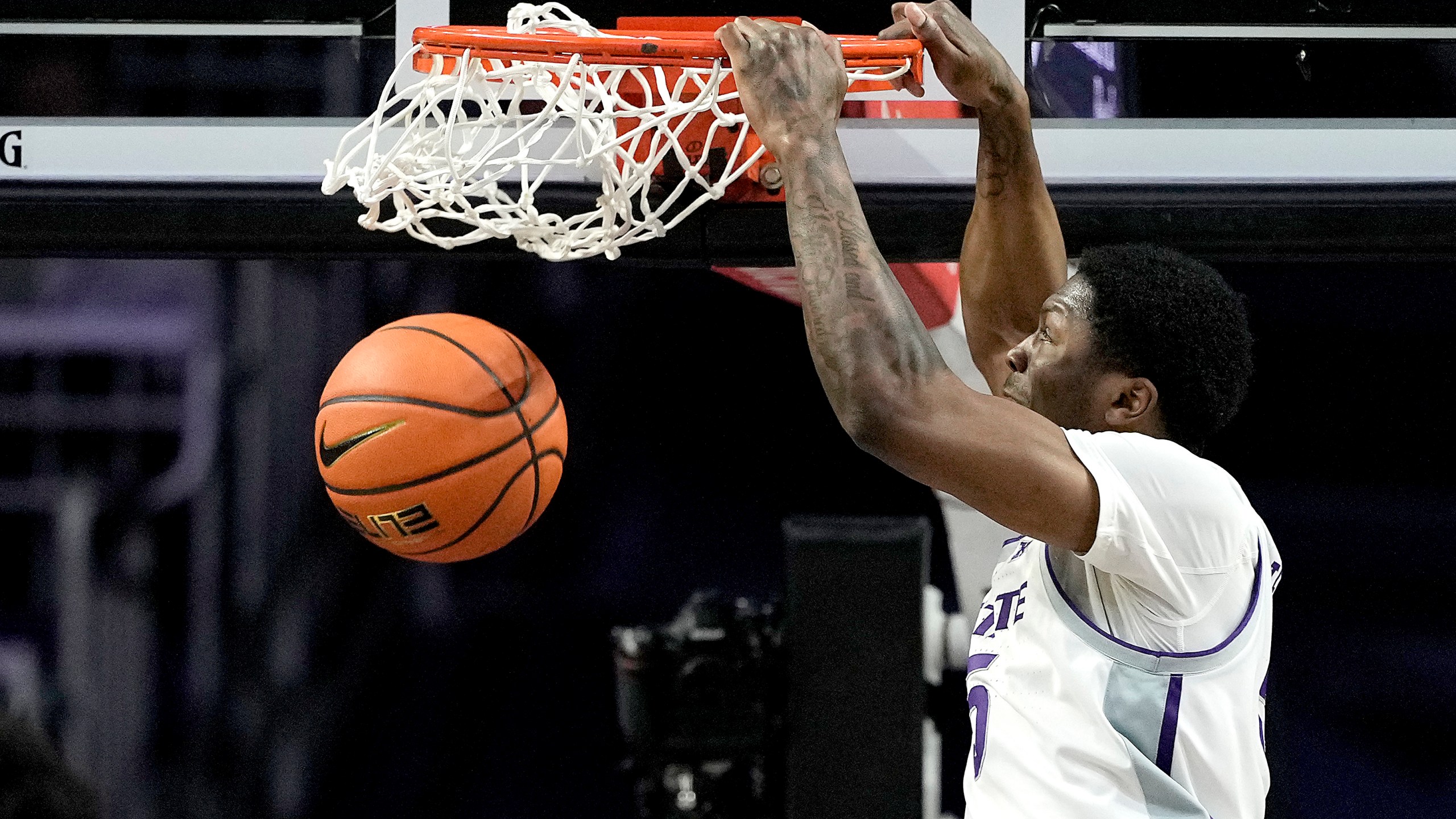Kansas State guard Cam Carter dunks the ball during the first half of an NCAA college basketball game against Iowa State Saturday, March 9, 2024, in Manhattan, Kan. (AP Photo/Charlie Riedel)