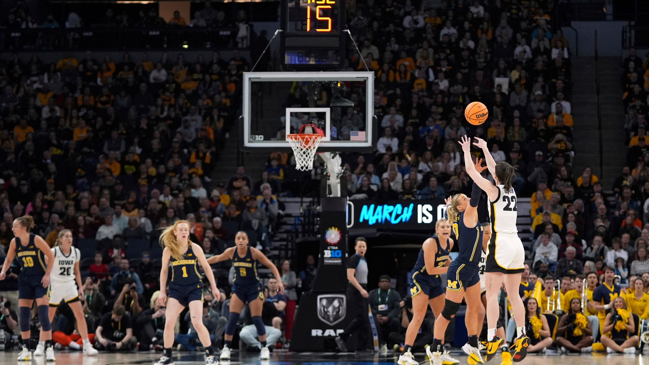 Iowa guard Caitlin Clark (22) shoots during the first half of an NCAA college basketball game against Michigan in the semifinals of the Big Ten women's tournament Saturday, March 9, 2024, in Minneapolis. (AP Photo/Abbie Parr)