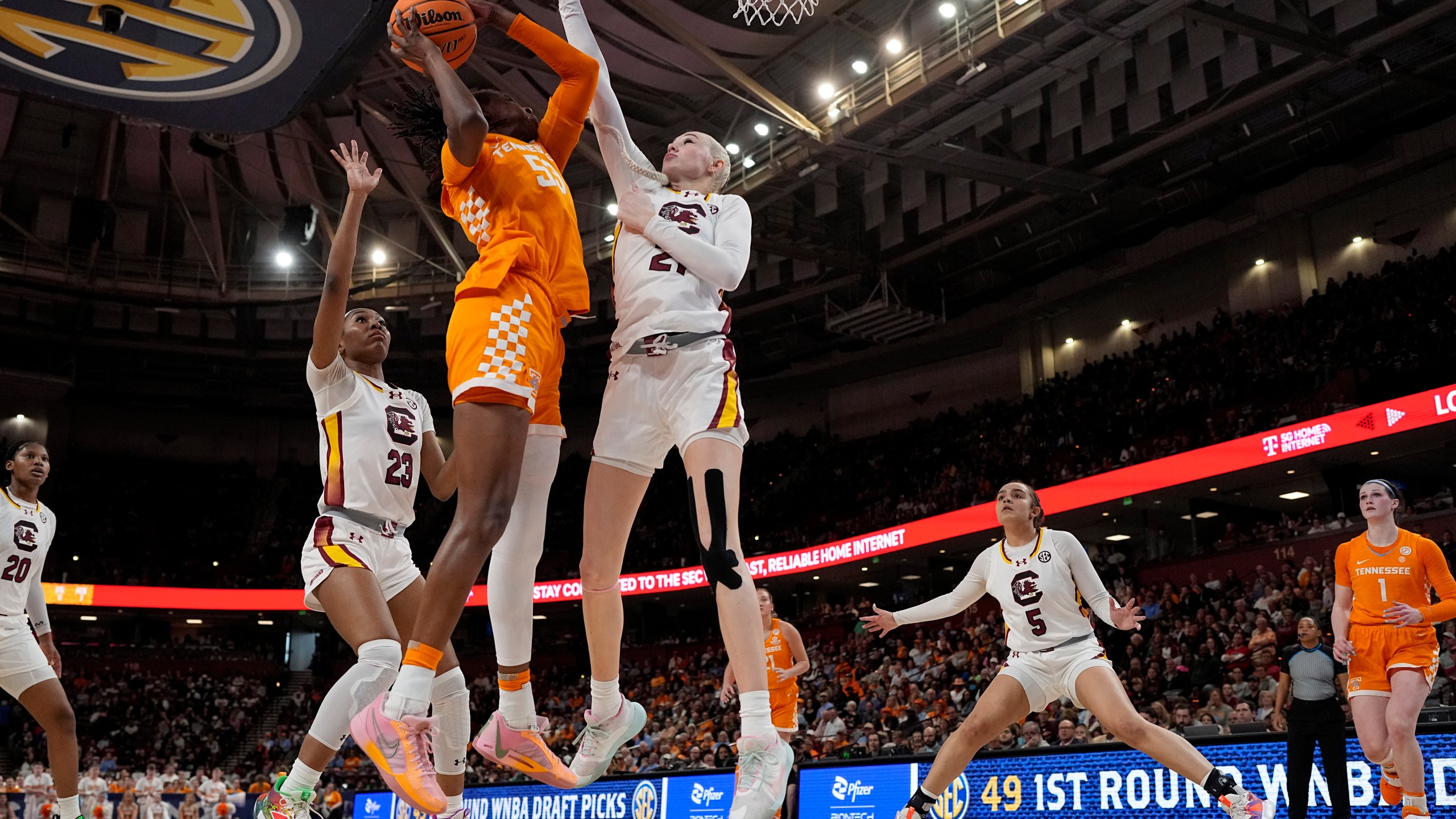 South Carolina forward Chloe Kitts (21) blocks a shot by Tennessee forward Jillian Hollingshead during the first half of an NCAA college basketball game at the Southeastern Conference women's tournament Saturday, March 9, 2024, in Greenville, S.C. (AP Photo/Chris Carlson)