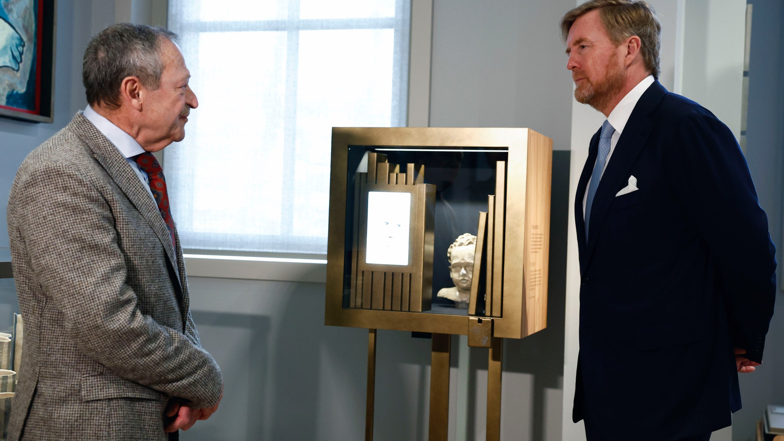 Netherlands' King Willem Alexander, right, tours the National Holocaust Museum in Amsterdam, Netherlands, Sunday, March 10, 2024. The Netherlands's National Holocaust Museum is opening on Sunday in a ceremony presided over by the Dutch king as well as Israeli President Isaac Herzog, whose presence is prompting protest because of Israel's deadly offensive against Palestinians in Gaza. (Piroschka van de Wouw/Pool Photo via AP)