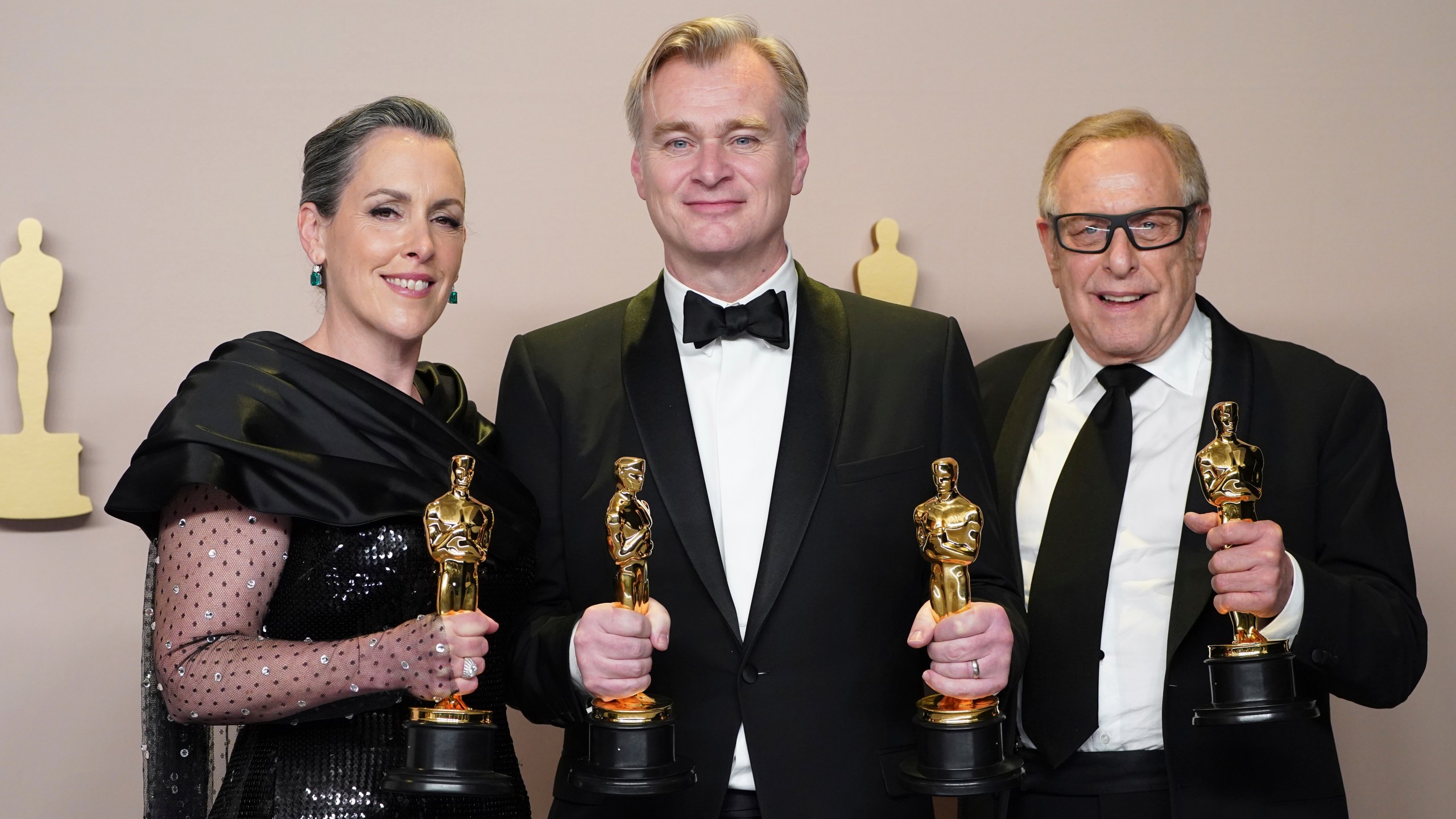 Emma Thomas, from left, Christopher Nolan, and Charles Roven pose in the press room with the award for best picture for "Oppenheimer" at the Oscars on Sunday, March 10, 2024, at the Dolby Theatre in Los Angeles. (Photo by Jordan Strauss/Invision/AP)