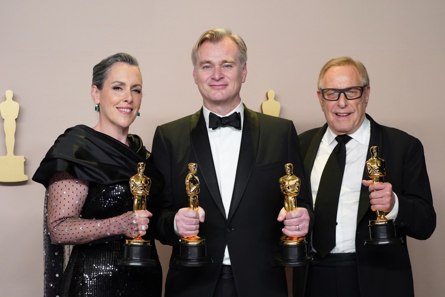 Emma Thomas, from left, Christopher Nolan, and Charles Roven pose in the press room with the award for best picture for "Oppenheimer" at the Oscars on Sunday, March 10, 2024, at the Dolby Theatre in Los Angeles. (Photo by Jordan Strauss/Invision/AP)