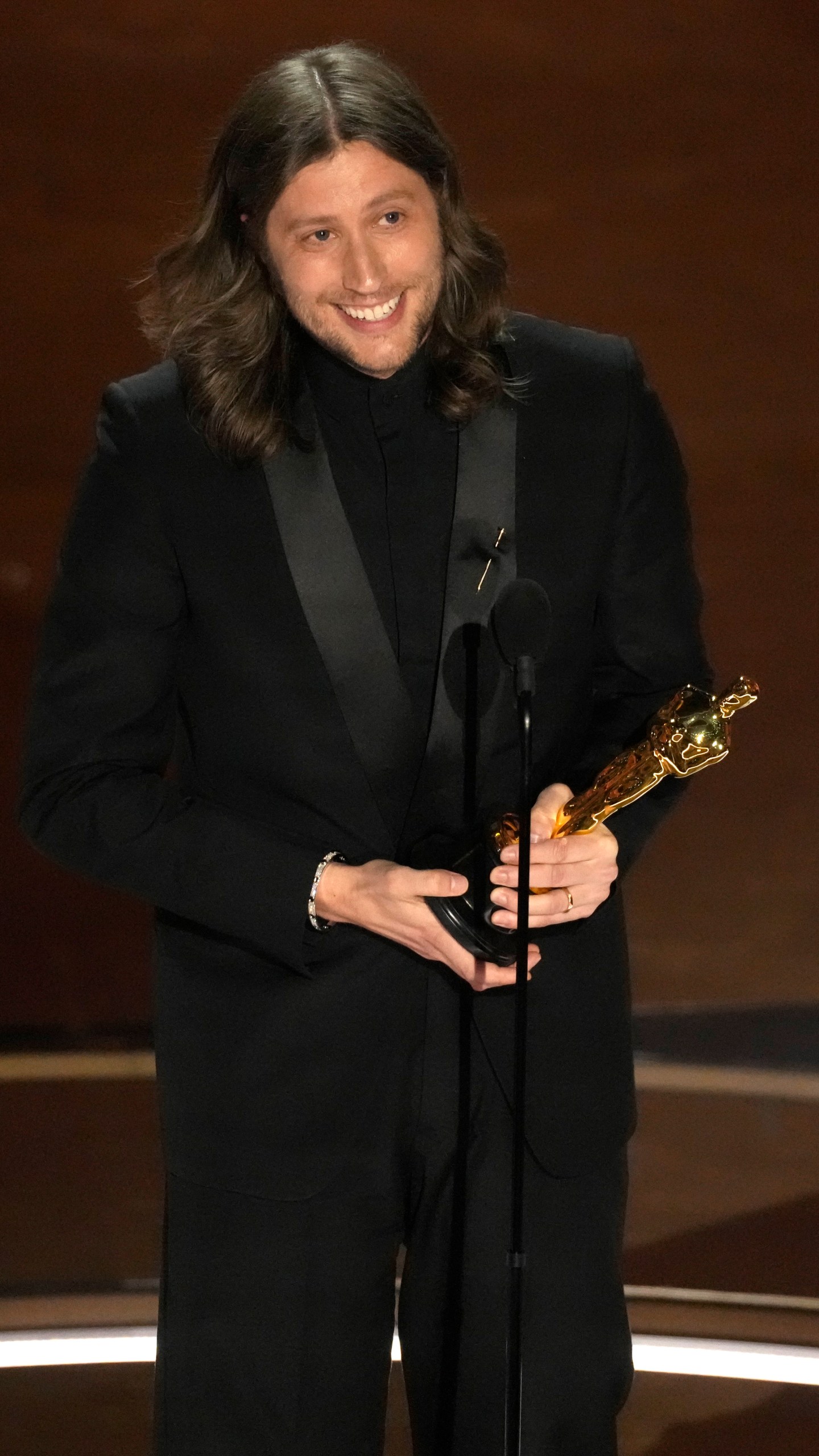 Ludwig Goransson accepts the award for best original score for "Oppenheimer" during the Oscars on Sunday, March 10, 2024, at the Dolby Theatre in Los Angeles. (AP Photo/Chris Pizzello)