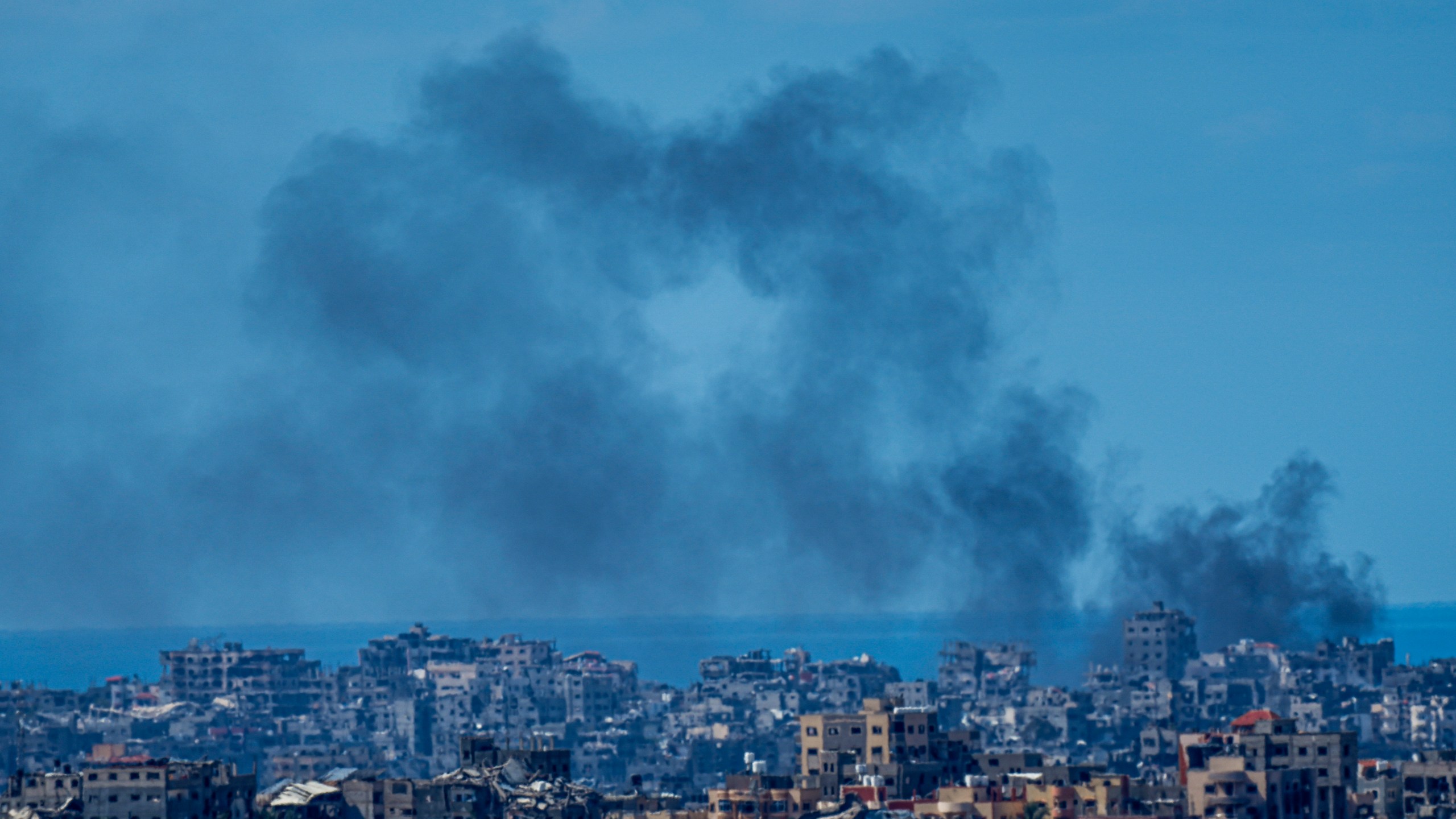 Smoke rises in the northern Gaza Strip, as seen from southern Israel, Sunday, March 10, 2024. (AP Photo/Ariel Schalit)