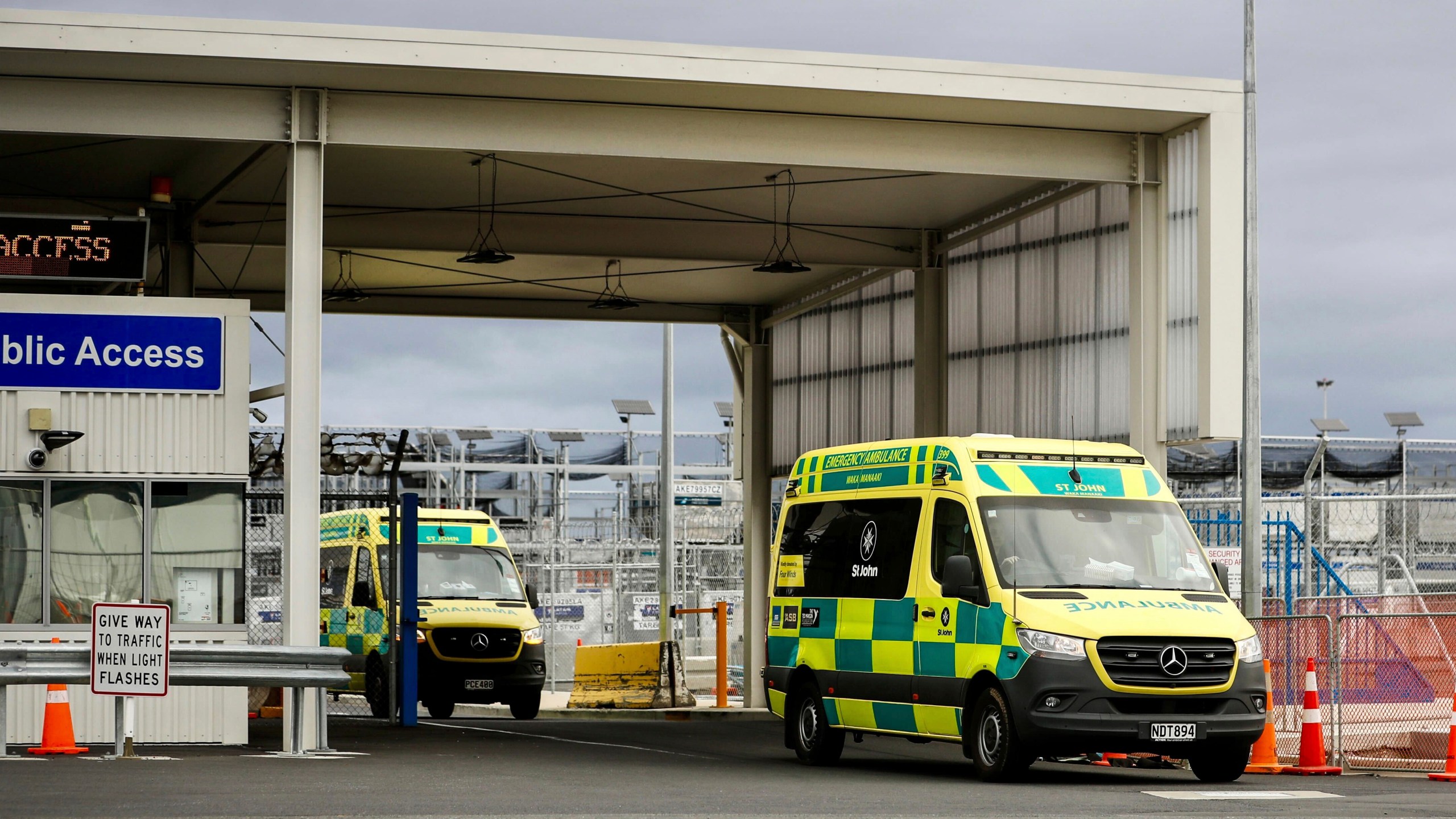 Ambulances leave Auckland International in Auckland, New Zealand, Monday, March 11, 2024. More than 20 people were injured after what officials described as a "technical event" on a Chilean plane traveling from Sydney, Australia to Auckland. (Dean Purcell/New Zealand Herald via AP)