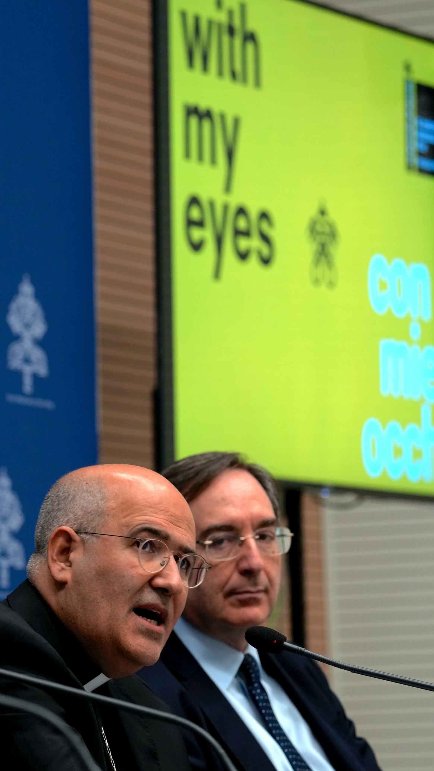 From left, Vatican Prefect of the Dicastery for Culture and Education, Card. José Tolentino de Mendonça and Giovanni Russo, head of the Italian Prison Administration attend a press conference at The Vatican, Monday, March 11, 2024, to present "With my Eyes", the Holy See pavillion for the 60th edition of the Venice Biennale of Arts opening on April 20th, 2024. (AP Photo/Domenico Stinellis)