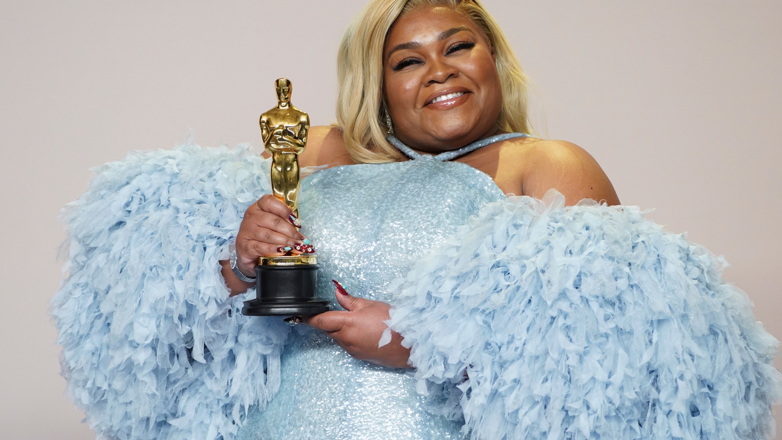 Da'Vine Joy Randolph poses in the press room with the award for best performance by an actress in a supporting role for "The Holdovers" at the Oscars on Sunday, March 10, 2024, at the Dolby Theatre in Los Angeles. (Photo by Jordan Strauss/Invision/AP)