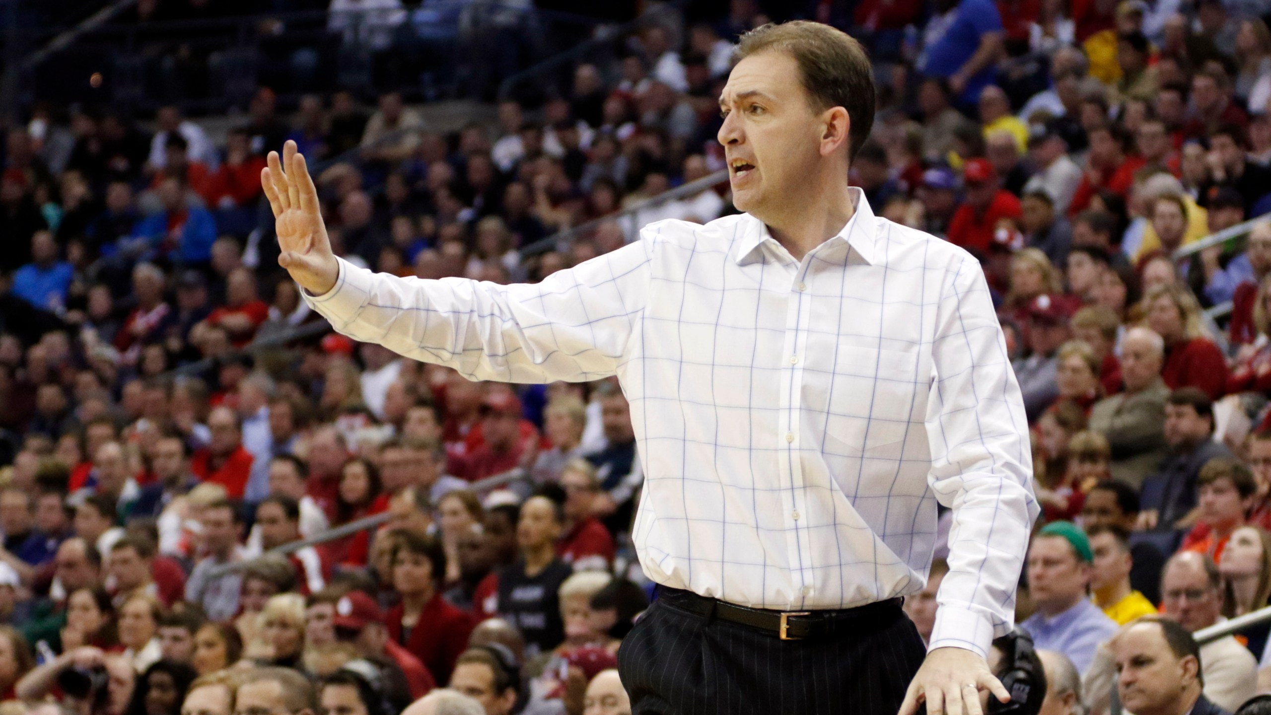 FILE - Then-Albany head coach Will Brown yells at his team in the second half of an NCAA tournament college basketball game against Oklahoma in the Round of 64 in Columbus, Ohio, Friday, March 20, 2015. The coaching job Will Brown has done in his first year at The College of Saint Rose is impressive. He won’t be at Saint Rose next season. Nobody will be. There is no next season. (AP Photo/Paul Vernon, File)