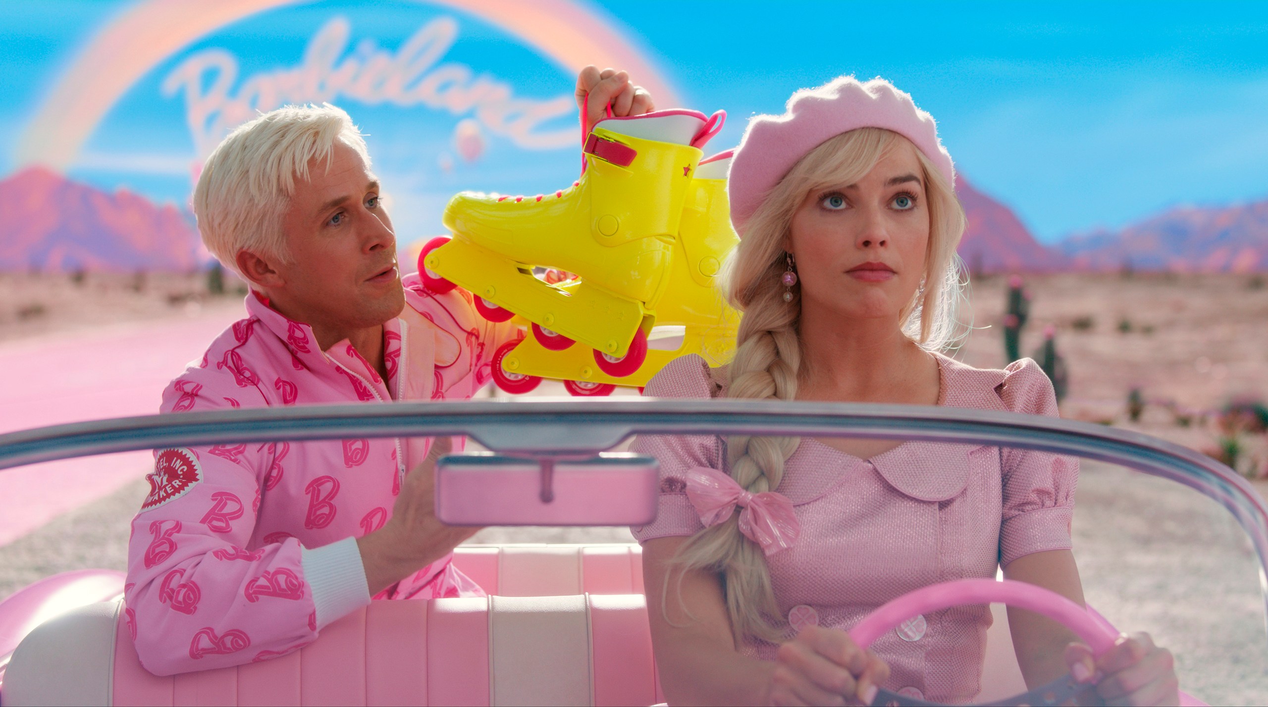 This image released by Warner Bros. Pictures shows Ryan Gosling, left, and Margot Robbie in a scene from "Barbie." (Warner Bros. Pictures via AP)
