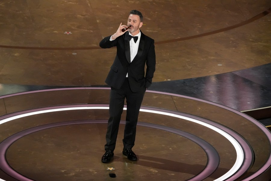 Jimmy Kimmel drinks a shot of tequila during the Oscars on Sunday, March 10, 2024, at the Dolby Theatre in Los Angeles. (AP Photo/Chris Pizzello)