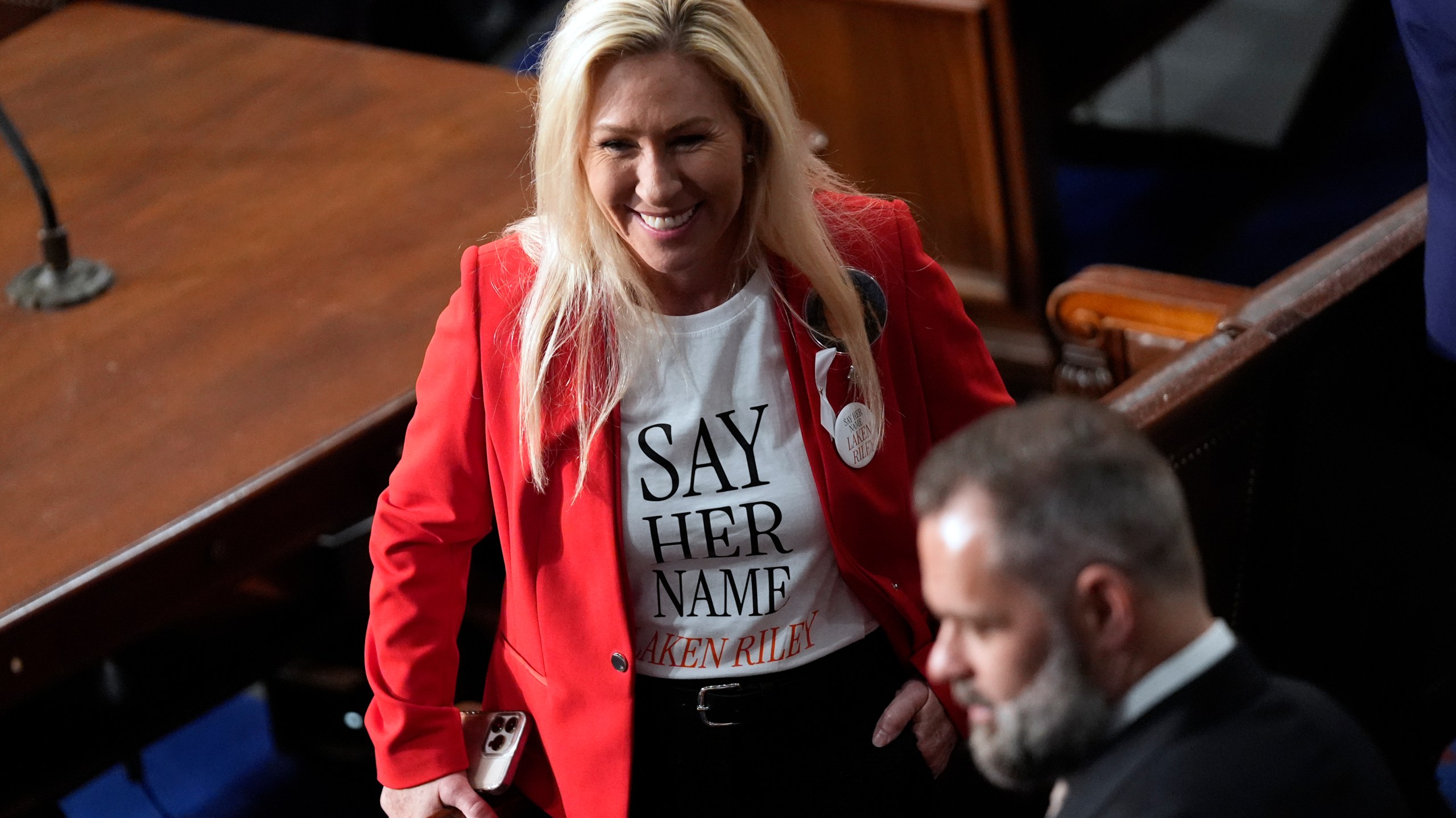 Rep. Marjorie Taylor Greene, R-Ga., wears a Laken Riley shirt as she arrives before President Joe Biden delivers the State of the Union address to a joint session of Congress at the U.S. Capitol, Thursday March 7, 2024, in Washington. (AP Photo/Andrew Harnik)