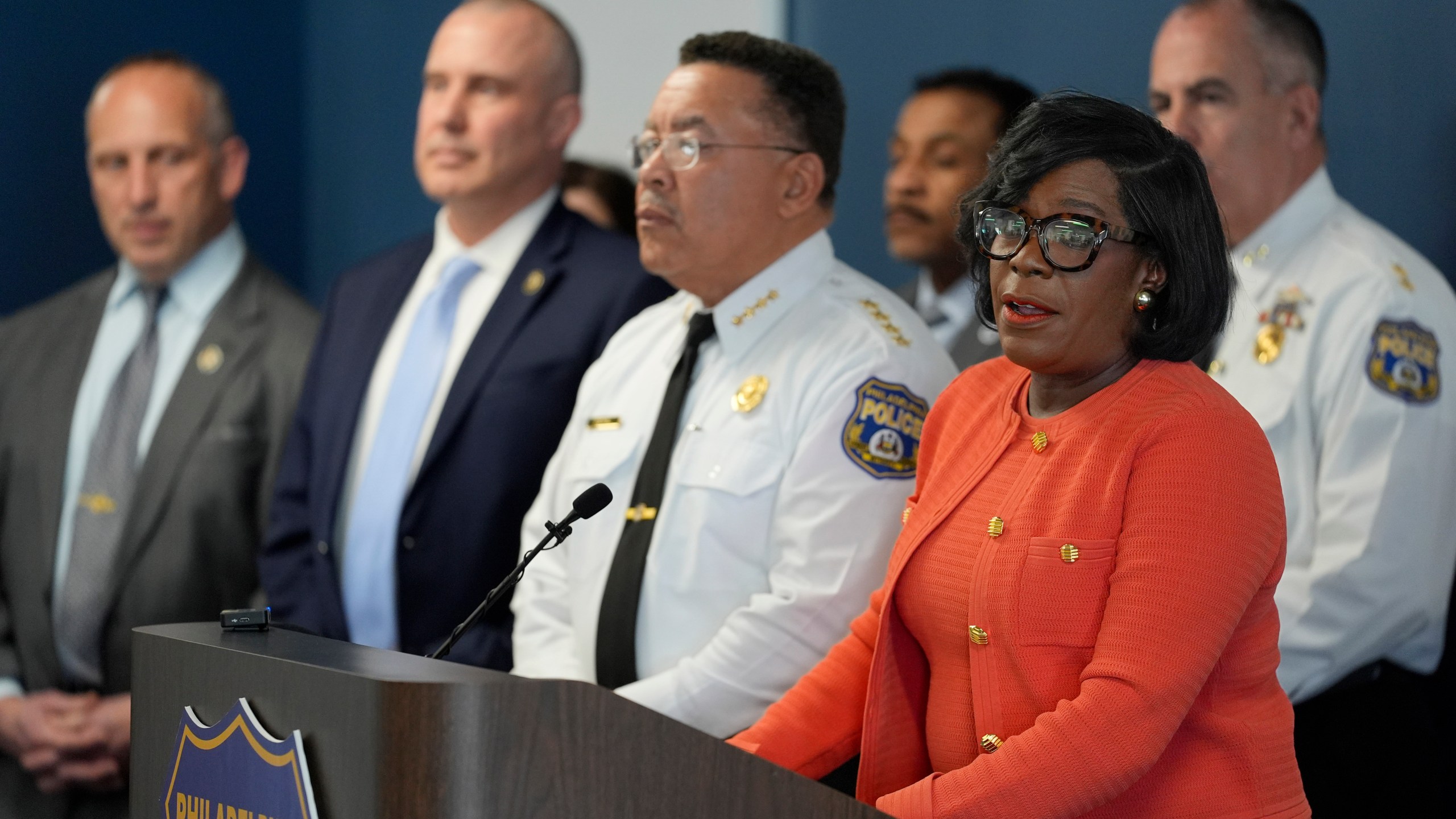 Philadelphia Mayor Cherelle Parker, right, accompanied by Police Commissioner Kevin Bethel, center, speaks during a news conference in Philadelphia, Monday, March 11, 2024. The driver and a suspected gunman are in custody in the shooting of multiple Philadelphia high school students at a bus stop, a law enforcement official told The Associated Press on Monday. (AP Photo/Matt Rourke)