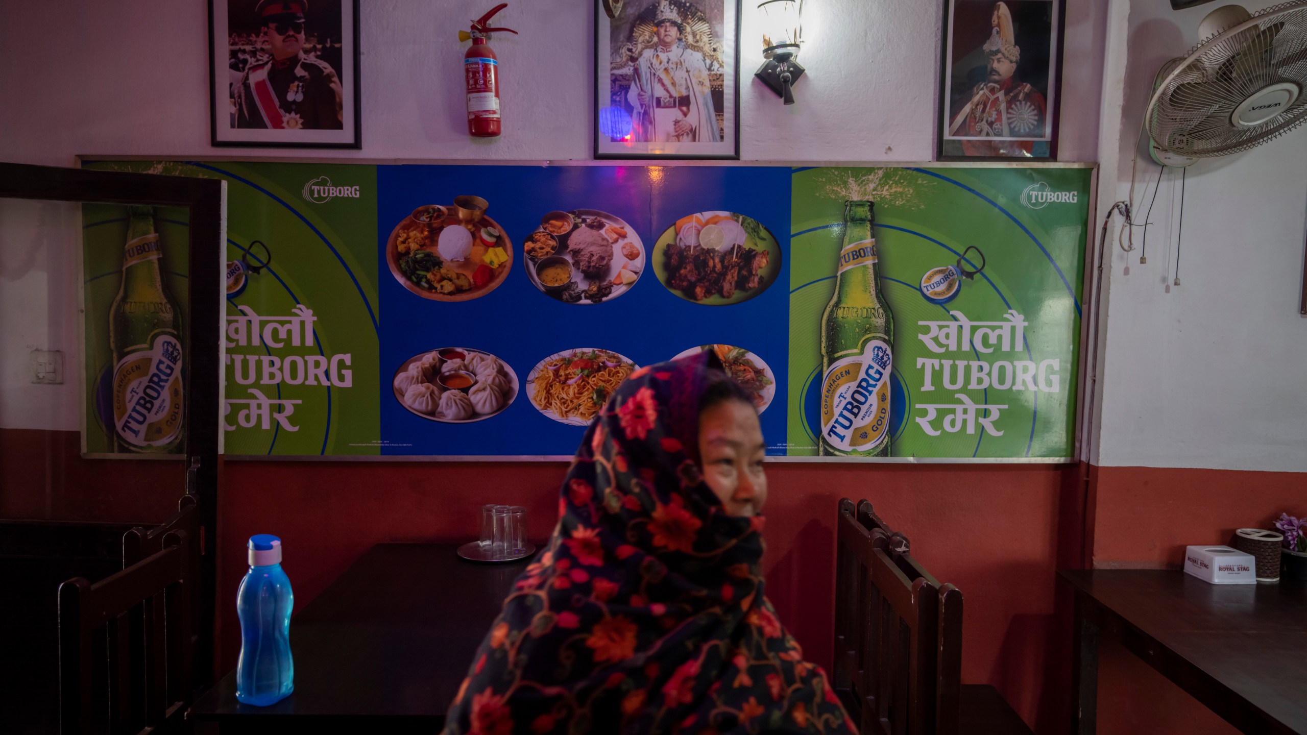Photographs of Nepal's former kings are displayed on the wall of a restaurant in Kathmandu, Nepal, Feb. 26, 2024.. Nepal’s once unpopular monarchy — abolished after centuries of rule over the Himalayan nation — is hoping to regain some of its lost glory. Royalist groups and supporters of former King Gyanendra have been holding rallies to demand the restoration of the monarchy and the nation’s former status as a Hindu state. (AP Photo/Niranjan Shrestha)