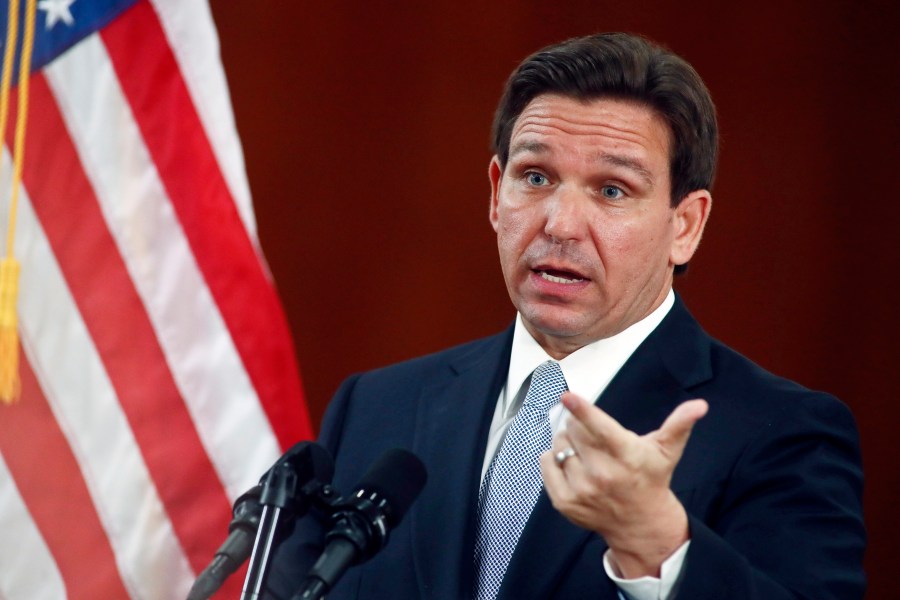 FILE - Florida Gov. Ron DeSantis answers questions from the media, March 7, 2023, at the state Capitol in Tallahassee, Fla. Students and teachers will be able to speak freely about sexual orientation and gender identity in Florida classrooms under a settlement reached Monday, March 11, 2024 between Florida education officials and civil rights attorneys who had challenged a state law which critics dubbed “Don't Say Gay.” (AP Photo/Phil Sears, File)