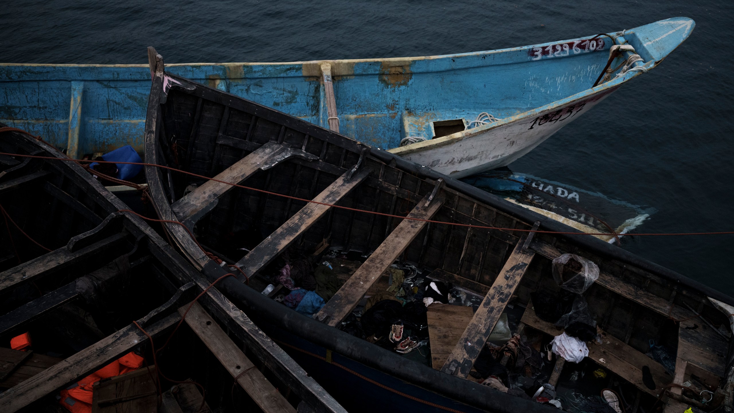 FILE - Empty boats used by migrants are moored at the port of Arguineguin in the Canary island of Gran Canaria, Spain, on Nov. 21, 2021. Spanish maritime rescuers say they have pulled 38 people alive and recovered two bodies from a migrant boat that was trying to reach the Canary Islands. (AP Photo/Felipe Dana)