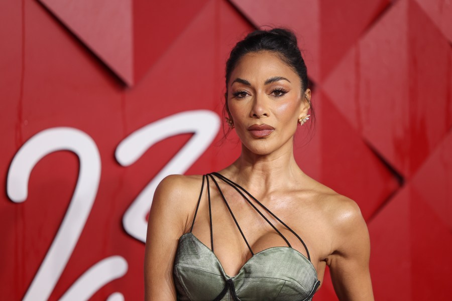 FILE - Nicole Scherzinger poses for photographers upon arrival at the British Fashion Awards, Dec. 4, 2023 in London. An acclaimed revival of Andrew Lloyd Webber’s “Sunset Boulevard” and a play about the travails of England’s national soccer team lead the race for the Olivier Awards recognizing work on the London stage. The 11 nominations for “Sunset Boulevard” include best actress in a musical for Nicole Scherzinger. Winners will be announced April 14 in a ceremony at London’s Royal Albert Hall. (Vianney Le Caer/Invision/AP, File)