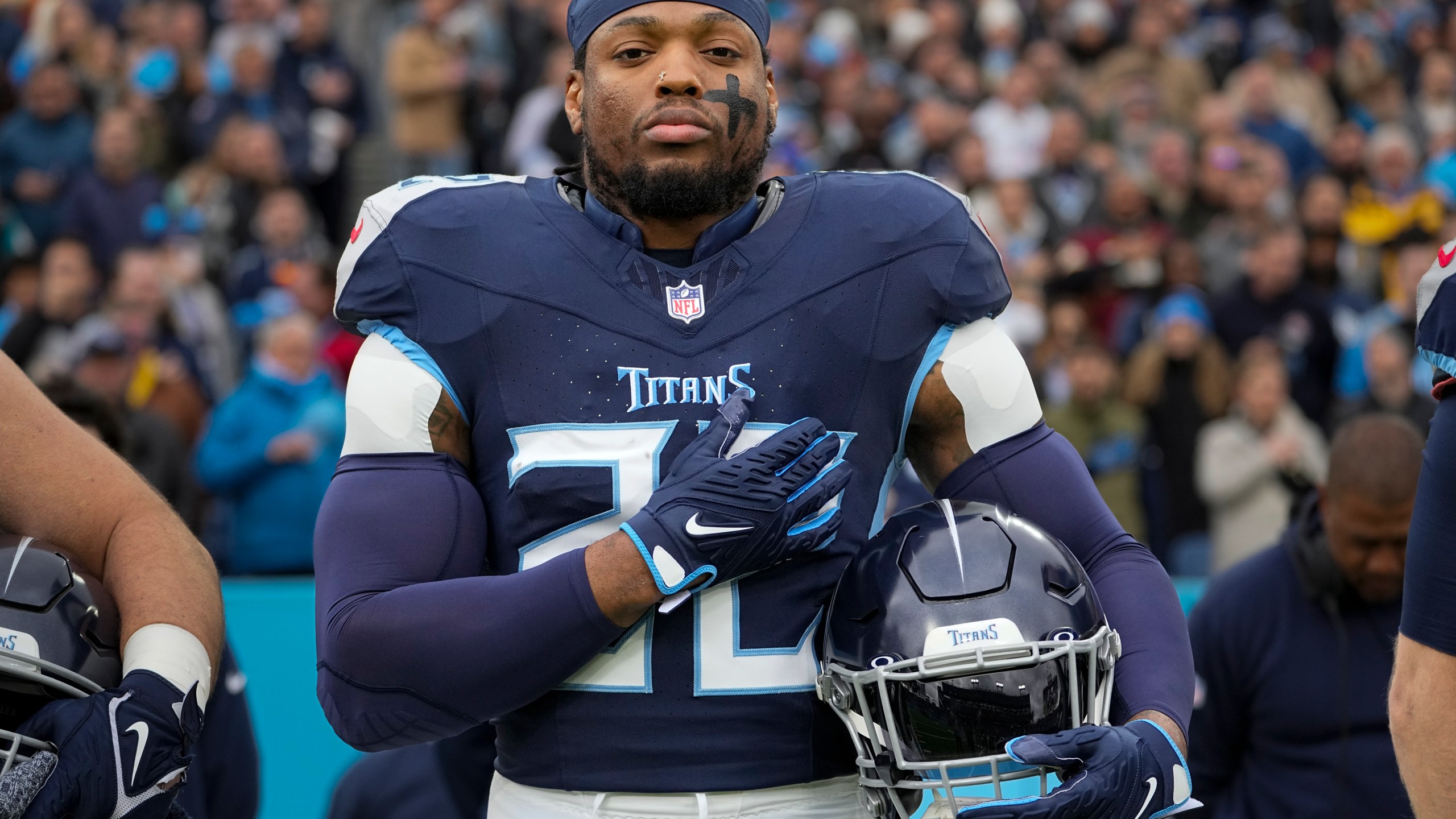 FILE -Tennessee Titans running back Derrick Henry stands for the national anthem before an NFL football game against the Jacksonville Jaguars, Sunday, Jan. 7, 2024, in Nashville, Tenn. Derrick Henry is back in the gym, eager to prove turning 30 is just a number that shouldn’t affect the four-time Pro Bowl running back’s value on the NFL's open market.(AP Photo/George Walker IV, File)