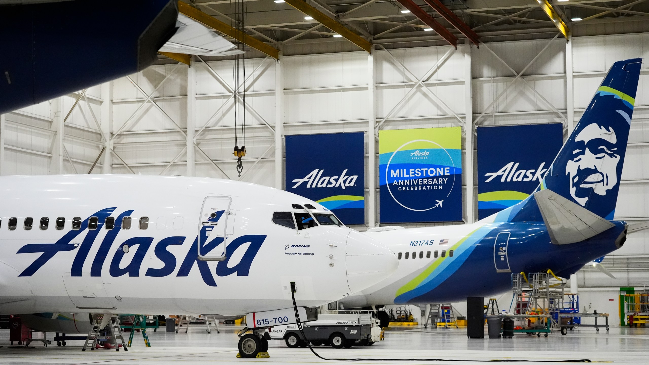 Alaska Airlines aircraft sit in the airline's hangar at Seattle-Tacoma International Airport Wednesday, Jan. 10, 2024, in SeaTac, Wash. Boeing has acknowledged in a letter to Congress that it cannot find records for work done on a door panel that blew out on an Alaska Airlines flight over Oregon two months ago. Ziad Ojakli, Boeing executive vice president and chief government lobbyist, wrote to Sen. Maria Cantwell on Friday, March 8 saying, “We have looked extensively and have not found any such documentation.” (AP Photo/Lindsey Wasson)