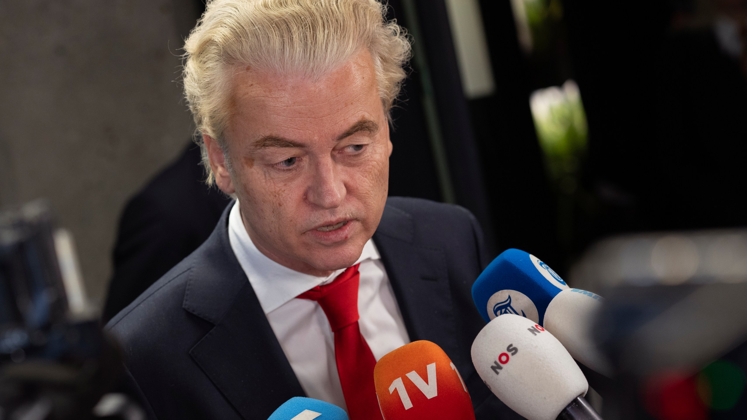 FILE - Geert Wilders, leader of the far-right party PVV, or Party for Freedom, talks to the media after a meeting with speaker of the House Vera Bergkamp, two days after Wilders won the most votes in a general election, in The Hague, Netherlands, on Nov. 24, 2023. Two days of behind-closed doors talks between four Dutch political leaders appear to have forced a breakthrough in negotiations to form a new ruling coalition nearly four months after a general election won by Wilders. While the exact contours of a new coalition Cabinet remain unclear, Kim Putters, who led the talks, believes that the parties are now ready to hammer out a deal. Putters was writing up a report Wednesday March 13, 2024 that he will present to lawmakers on Thursday. (AP Photo/Peter Dejong, File)