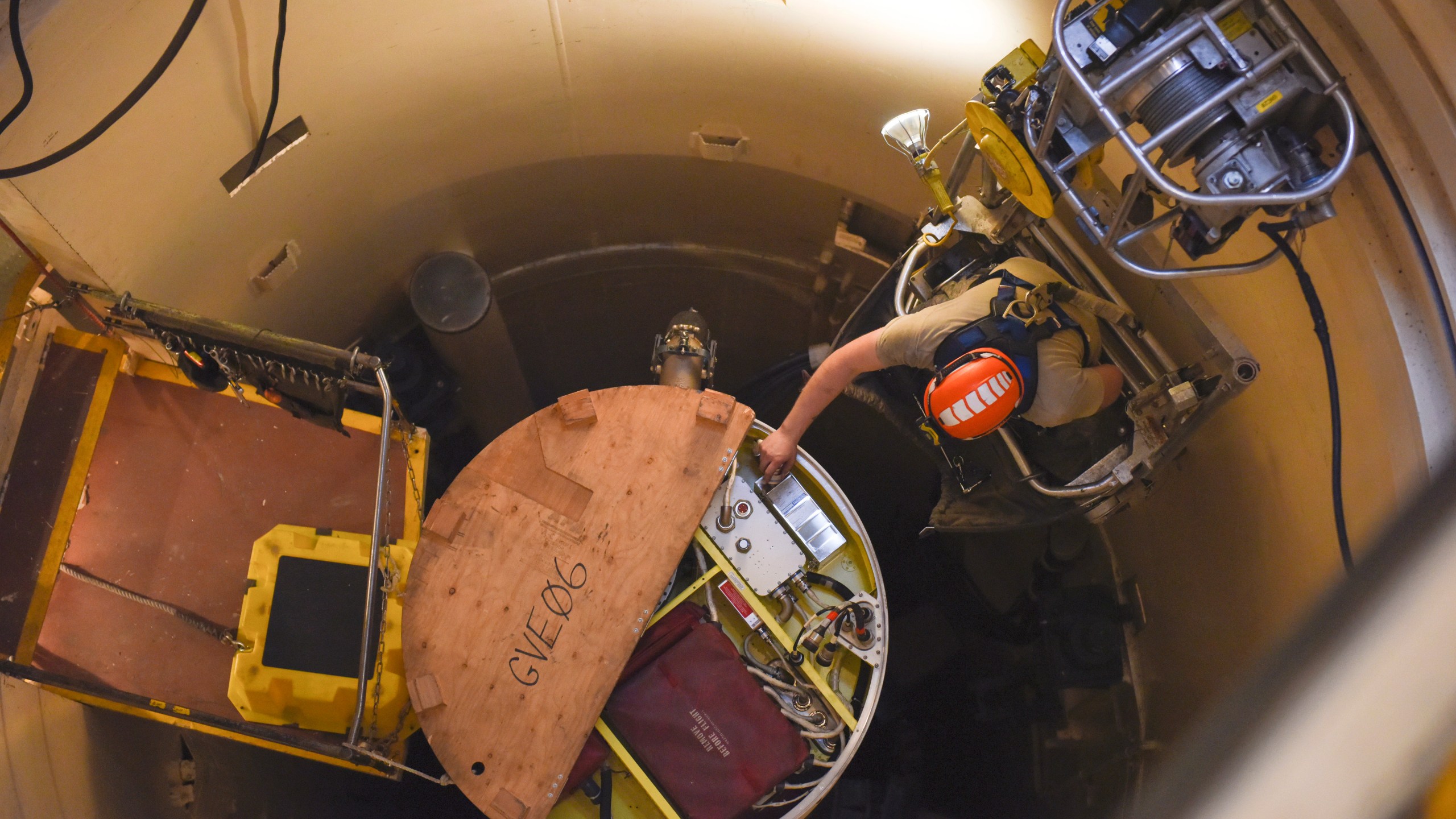 FILE - In this image provided by the U.S. Air Force, Airman 1st Class Jackson Ligon, 341st Missile Maintenance Squadron technician, examines the internals of an intercontinental ballistic missile during a Simulated Electronic Launch-Minuteman test Sept. 22, 2020, at a launch facility near Malmstrom Air Force Base in Great Falls, Mont. The Air Force is reporting the first data on cancer diagnoses among troops who worked with nuclear missiles. While the data is only about 25% complete, the Air Force on March 13, 2024, said the numbers are lower than they would have expected.(Tristan Day/U.S. Air Force via AP)