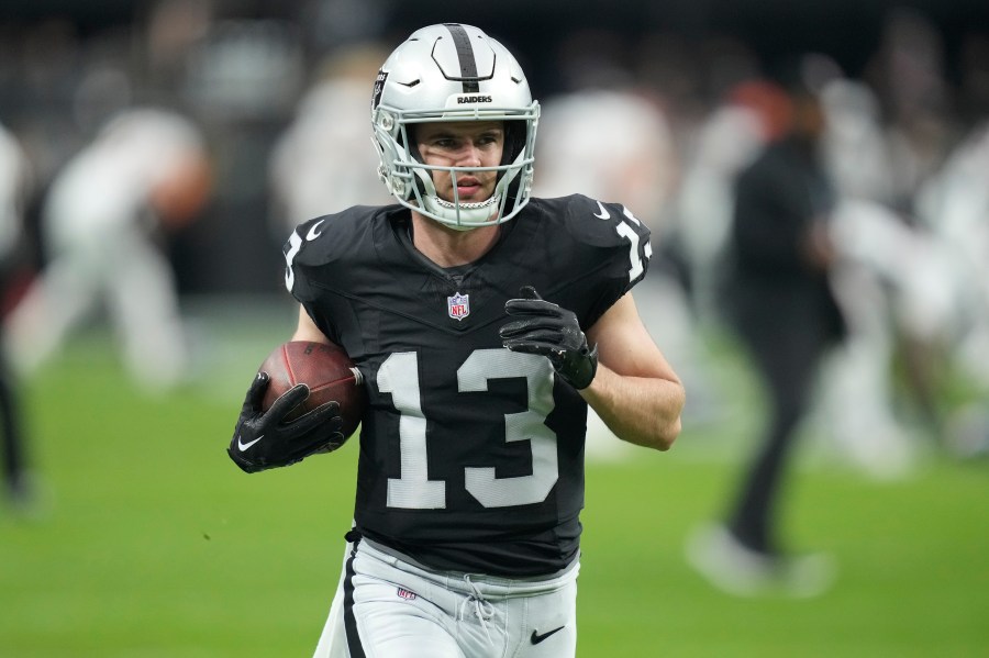 FILE - Las Vegas Raiders wide receiver Hunter Renfrow warms up before an NFL football game, Jan. 7, 2024, in Las Vegas. The Las Vegas Raiders have released Renfrow less than two years after signing him to a lucrative contract extension.nHe confirmed the long-expected decision on social media on Wednesday, March 13, 2024. (AP Photo/John Locher, File)