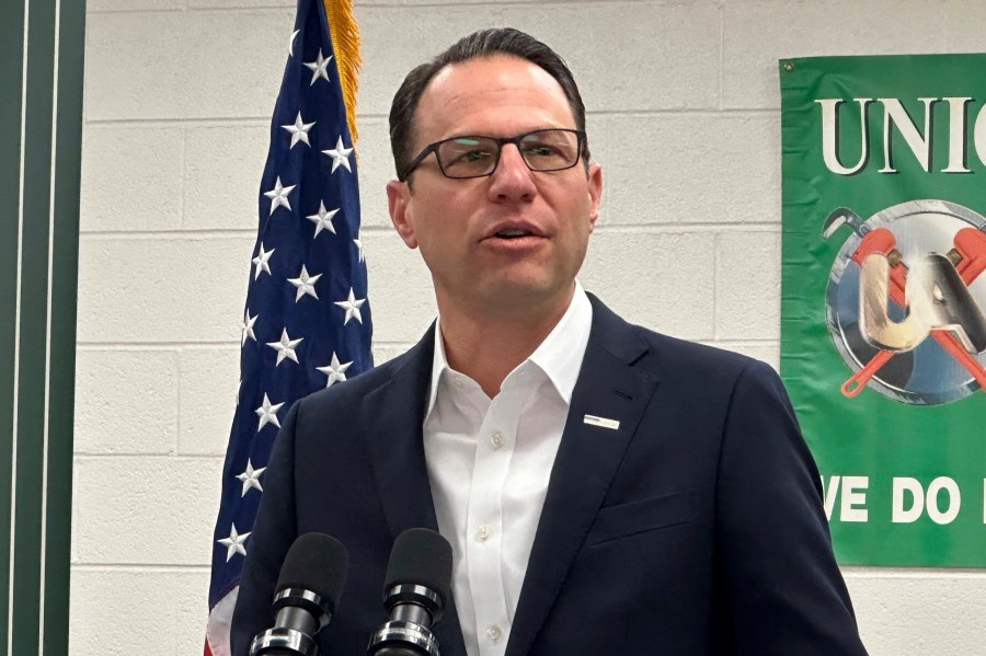 Pennsylvania Gov. Josh Shapiro speaks at a news conference at the United Association Local 524 union building in Scranton, Pa., on Wednesday, March 13, 2024. Shapiro announced he would back legislation to make power plant owners in Pennsylvania pay for their planet-warming greenhouse gas emissions and require utilities in the nation's third-biggest power-producer to buy more electricity from renewable sources. (AP Photo/Michael Rubinkam)