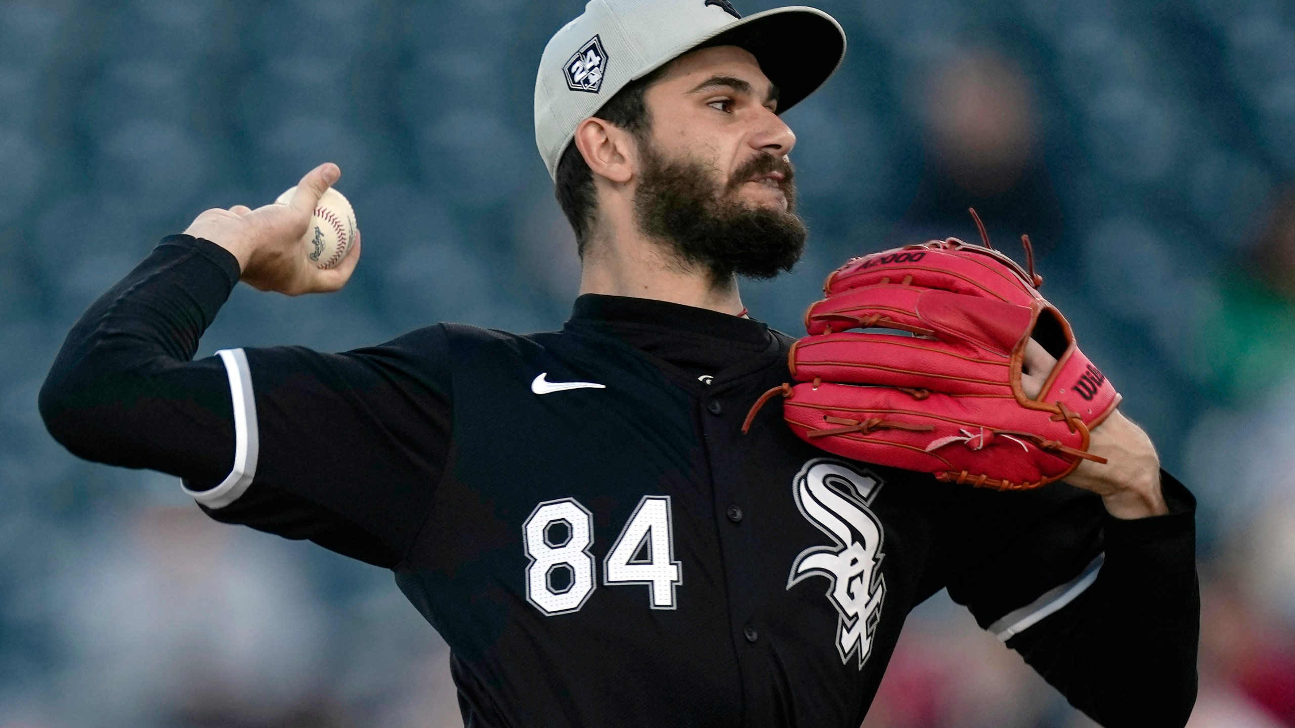 Chicago White Sox starting pitcher Dylan Cease throws in the first inning of a spring training baseball game against the Cincinnati Reds on Tuesday, March 12, 2024, in Goodyear, Ariz. (AP Photo/Carolyn Kaster)