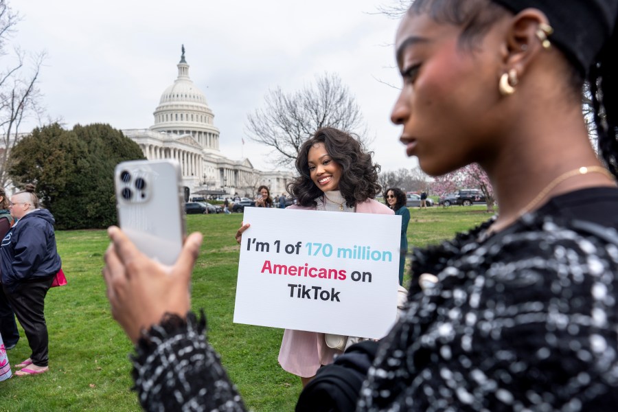 FILE - Devotees of TikTok, Mona Swain, center, and her sister, Rachel Swain, right, both of Atlanta, monitor voting at the Capitol in Washington, as the House passed a bill that would lead to a nationwide ban of the popular video app if its China-based owner doesn't sell, March 13, 2024. If some U.S. lawmakers have their way, the United States and China could end up with something in common: TikTok might not be available in either country. (AP Photo/J. Scott Applewhite, File)