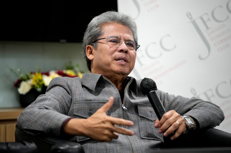 Todung Mulya Lubis, a prominent Indonesian lawyer who represents presidential candidate Ganjar Pranowo, gestures as he speaks during a talk in Jakarta, Indonesia, Thursday, March 14, 2024. The camps of the two presidential candidates who appear to have lost in Indonesia's election last month said Thursday they plan to challenge the results in the Constitutional Court with allegations of widespread fraud. (AP Photo/Dita Alangkara)