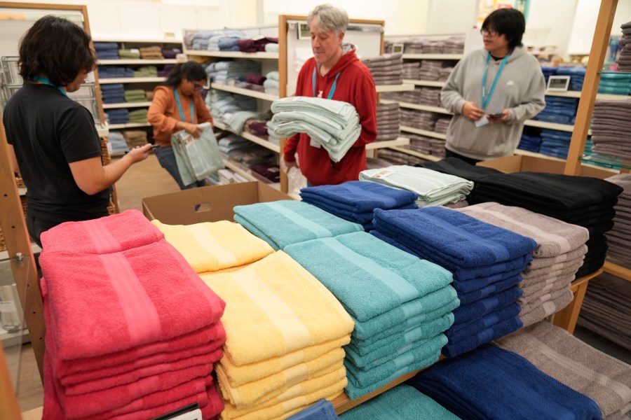 FILE - Employees arrange a display at a Kohl's store in Clifton, N.J., Jan. 26, 2024. On Thursday, March 14, 2024, the Commerce Department releases U.S. retail sales data for February. (AP Photo/Seth Wenig, File)