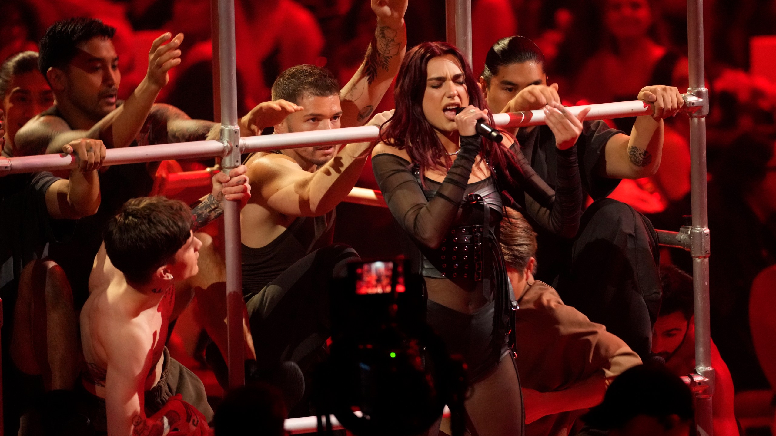 FILE - Dua Lipa performs during the 66th annual Grammy Awards on Sunday, Feb. 4, 2024, in Los Angeles. Dua Lipa, Sza and Shania Twain lead female charge at this year's Glastonbury festival in June. (AP Photo/Chris Pizzello, File)