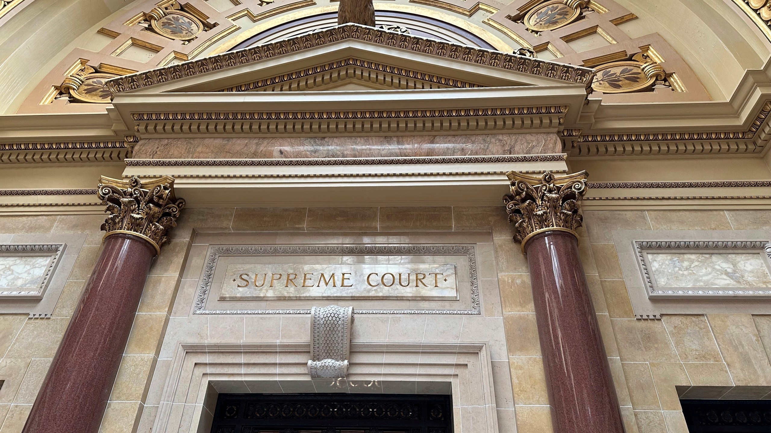 The entrance to the Wisconsin Supreme Court chambers in the state Capitol in Madison, Wis. The court on Thursday, March 14, 2024 ruled that religious exemptions to the state's unemployment tax don't apply to a Superior-based Catholic charities ministry. (AP Photo/Todd Richmond)