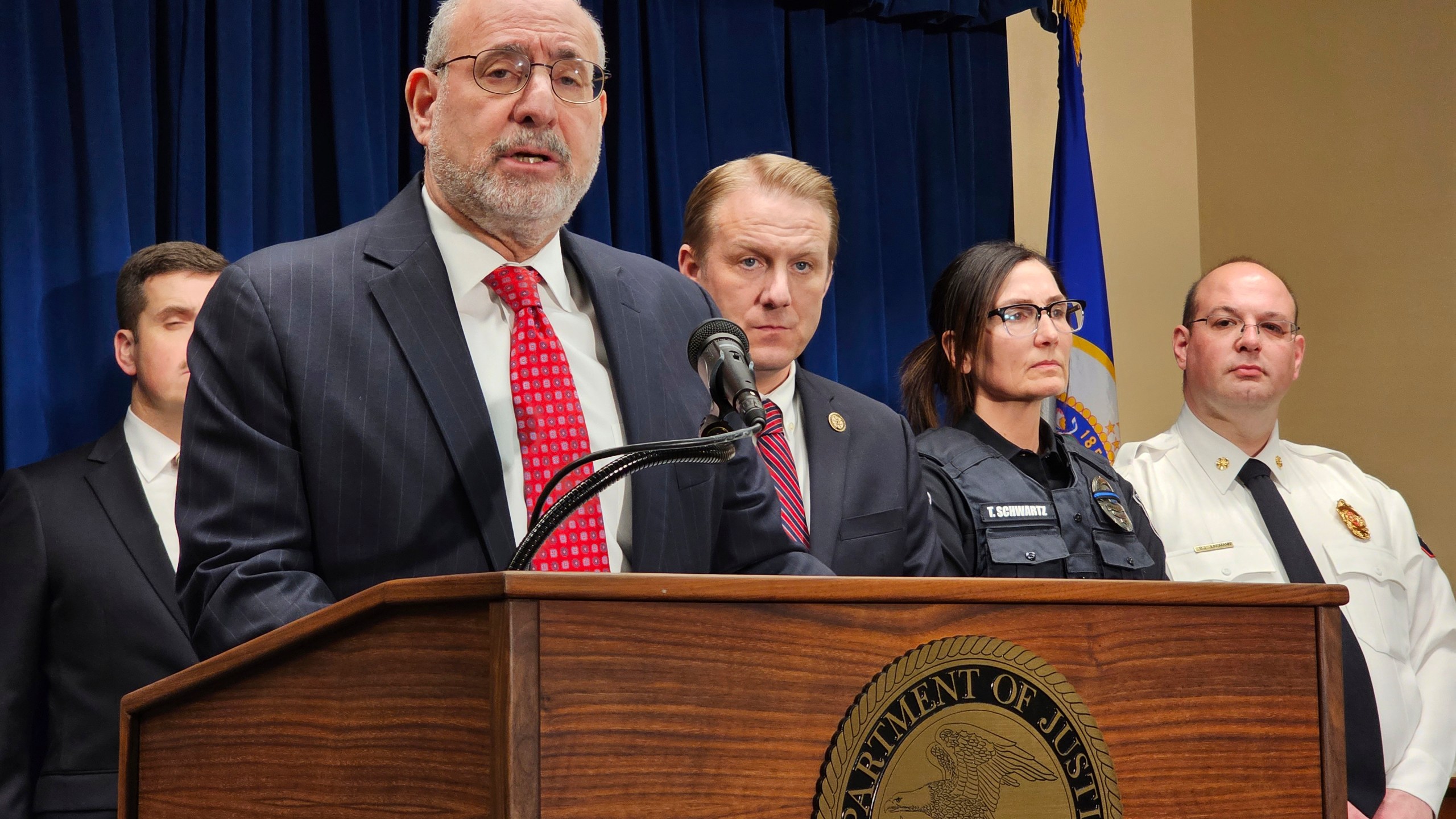 Attorney for Minnesota Andrew Luger speaks at a news conference in Minneapolis on Thursday, March 14, 2024, to announce charges against an alleged straw buyer of the guns used in the killings of three first responders at a home in the Minneapolis suburb of Burnsville in February. (AP Photo/Steve Karnowski)
