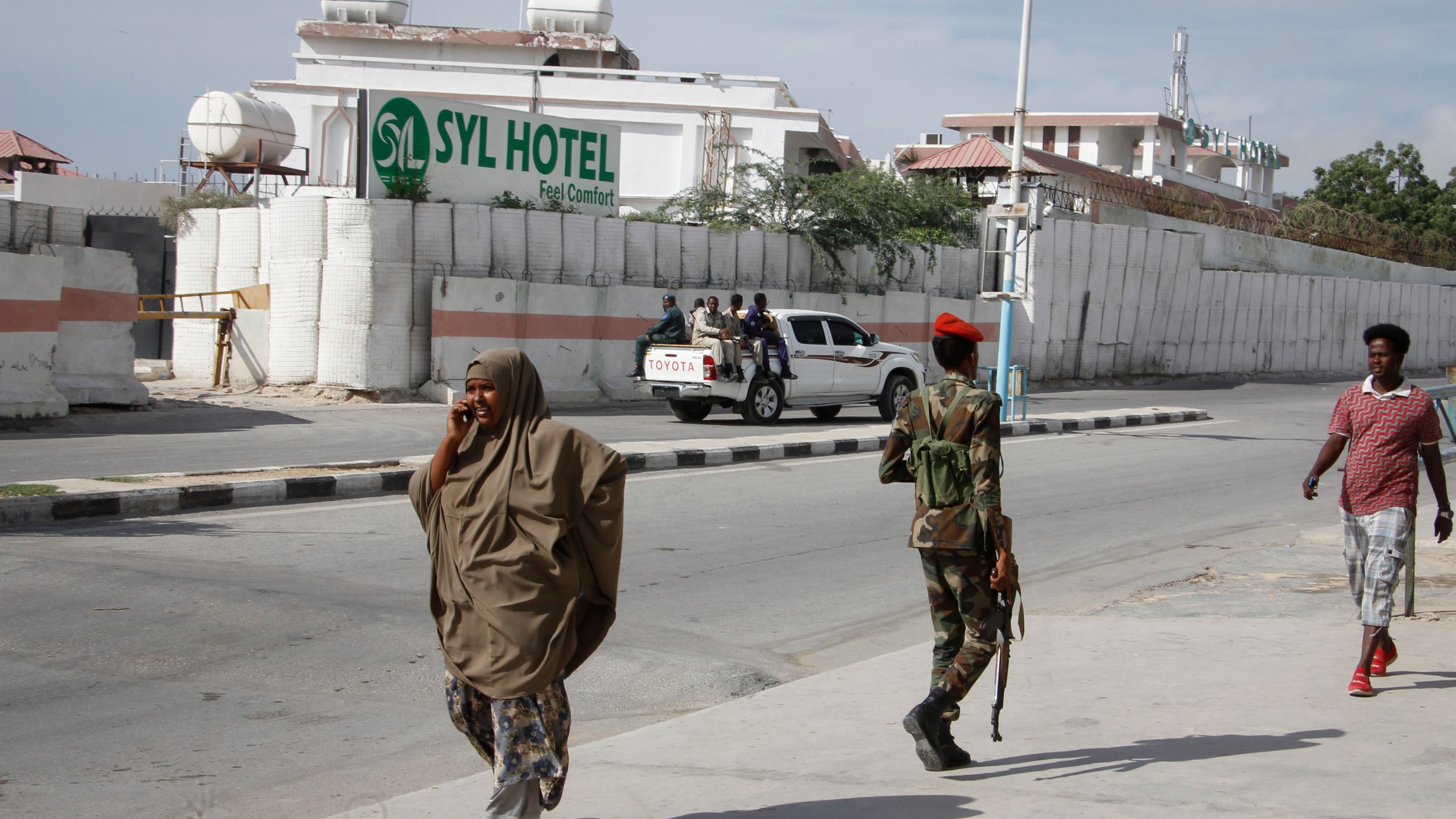 FILE - Somali security forces guard the entrance to the SYL hotel which was attacked by al-Shabab Islamic extremist rebels on Tuesday night, in Mogadishu, Somalia Wednesday, Dec. 11, 2019. The Somali extremist group al-Shabab says on Thursday, March 14, 2024, its fighters have attacked a hotel in the capital Mogadishu, where a loud explosion and gunfire have been heard. Al-Shabab said on its Telegram channel that its fighters managed to penetrate the SYL hotel, which is located not far from the presidential palace in a normally secure part of Mogadishu. (AP Photo/Farah Abdi Warsameh, File)