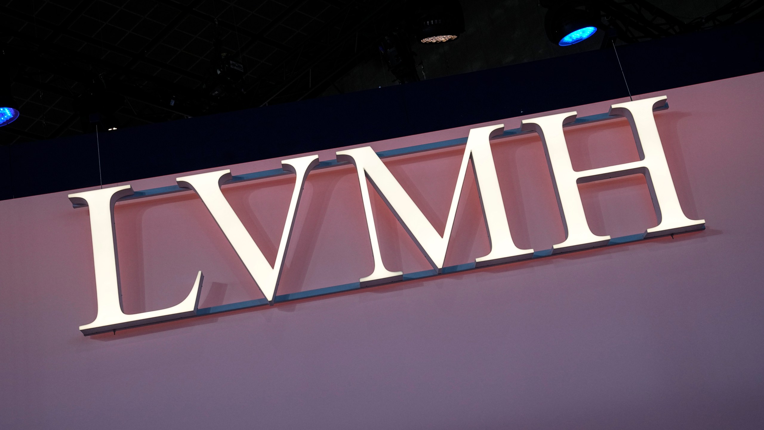 FILE - The LVMH logo is photographed at the Vivatech show in Paris, June 15, 2023. A pioneering bill to curb the rampant pace of fast fashion won unanimous approval in the French Parliament, making France one of the first countries in the world to target the influx of low-cost, mass-produced garments. It's a measure that promotes environmental protection and aims to safeguard France's prized fashion industry—in a week when French President Emmanuel Macron feted luxury giant LVMH CEO Bernard Arnault with the Legion d'Honneur, France's greatest civilian honor. (AP Photo/Michel Euler, File)