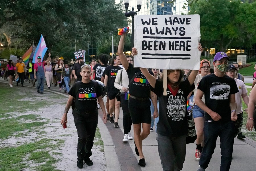 FILE - Hundreds of people, including immigrants rights groups, abortion rights groups and members of the LGBTQ community from across the state take part in a rally and march, Monday, May 1, 2023, in Orlando, Fla. The rights of LGBTQ+ people continue to be in flux across the U.S. with a new flurry of developments. (AP Photo/John Raoux, File)