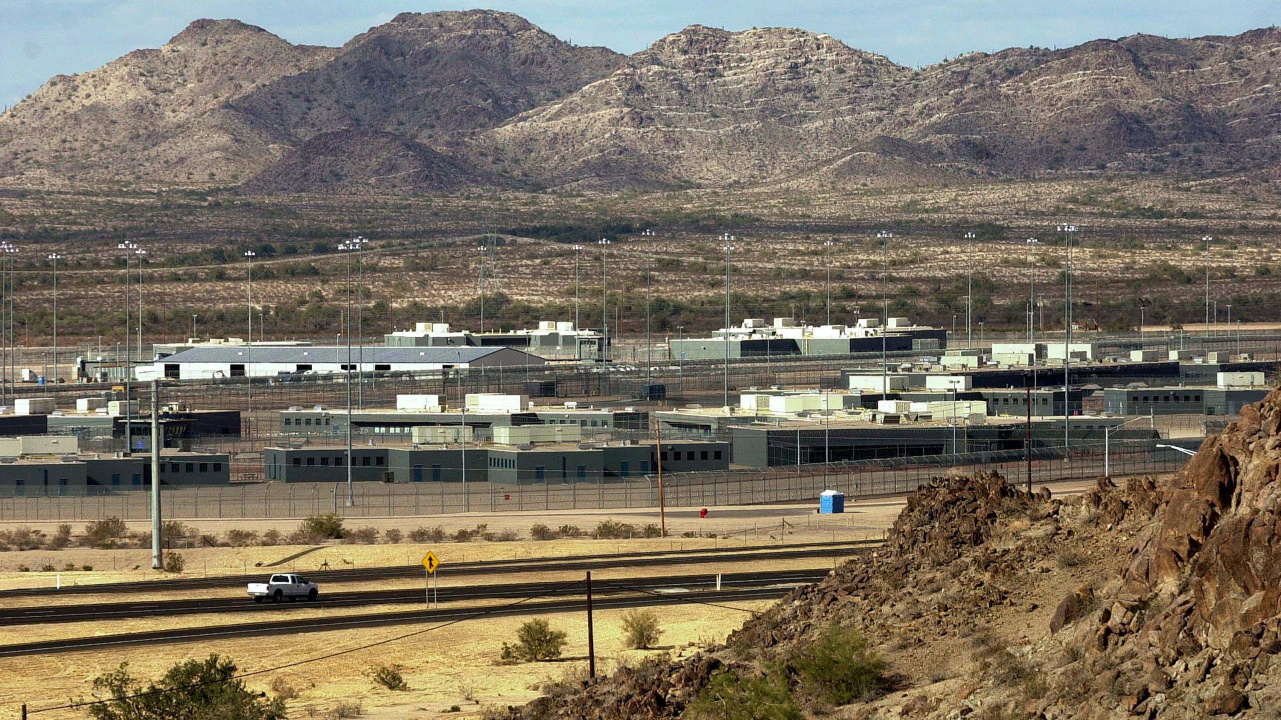 FILE - This Jan. 20, 2004, file photo shows the Arizona State Prison Complex-Lewis in Buckeye, Arizona. On Friday, March 15, 2024, a judge held a hearing in U.S. District Court in Phoenix to examine Arizona's noncompliance with a court order to improve medical and mental health care for the nearly 25,000 people incarcerated in Arizona's state-run prisons. (AP Photo/Tom Hood, File)