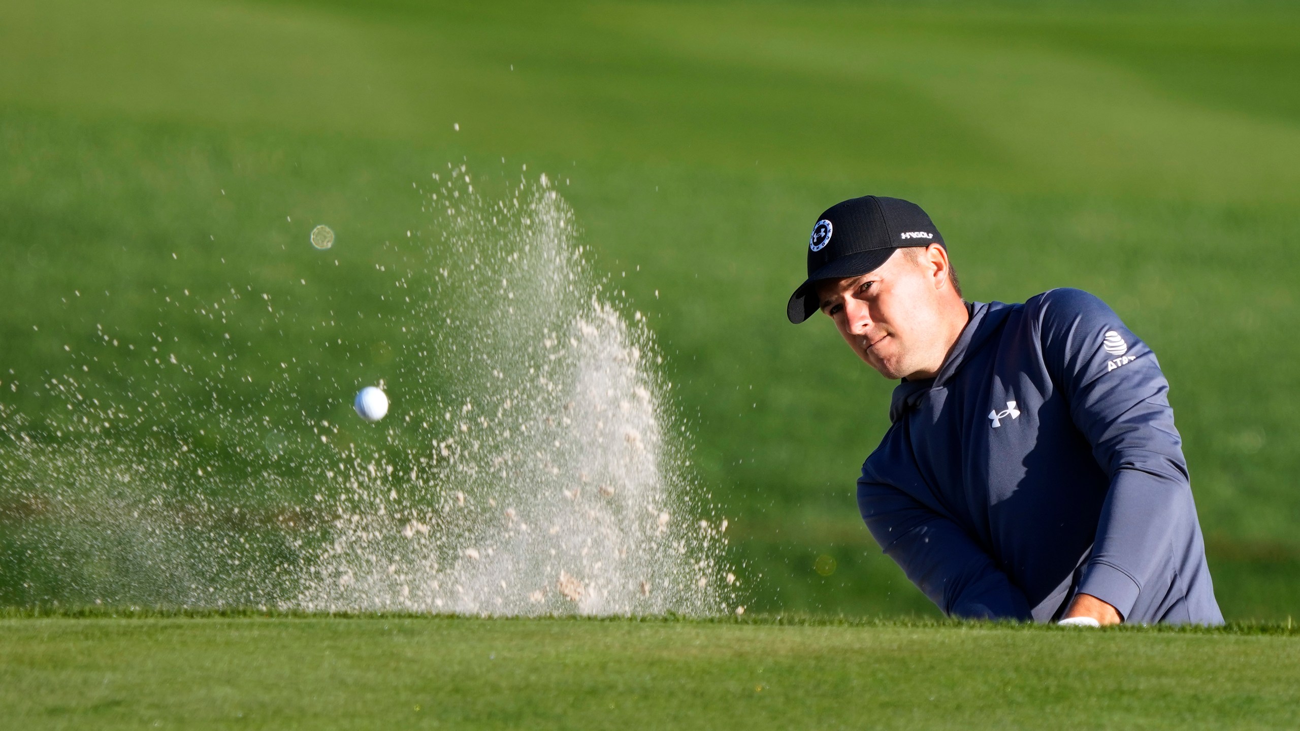 Jordan Spieth blasts from the sand trap along the 11th green during the first round of The Players Championship golf tournament Thursday, March 14, 2024, in Ponte Vedra Beach, Fla. (AP Photo/Lynne Sladky)
