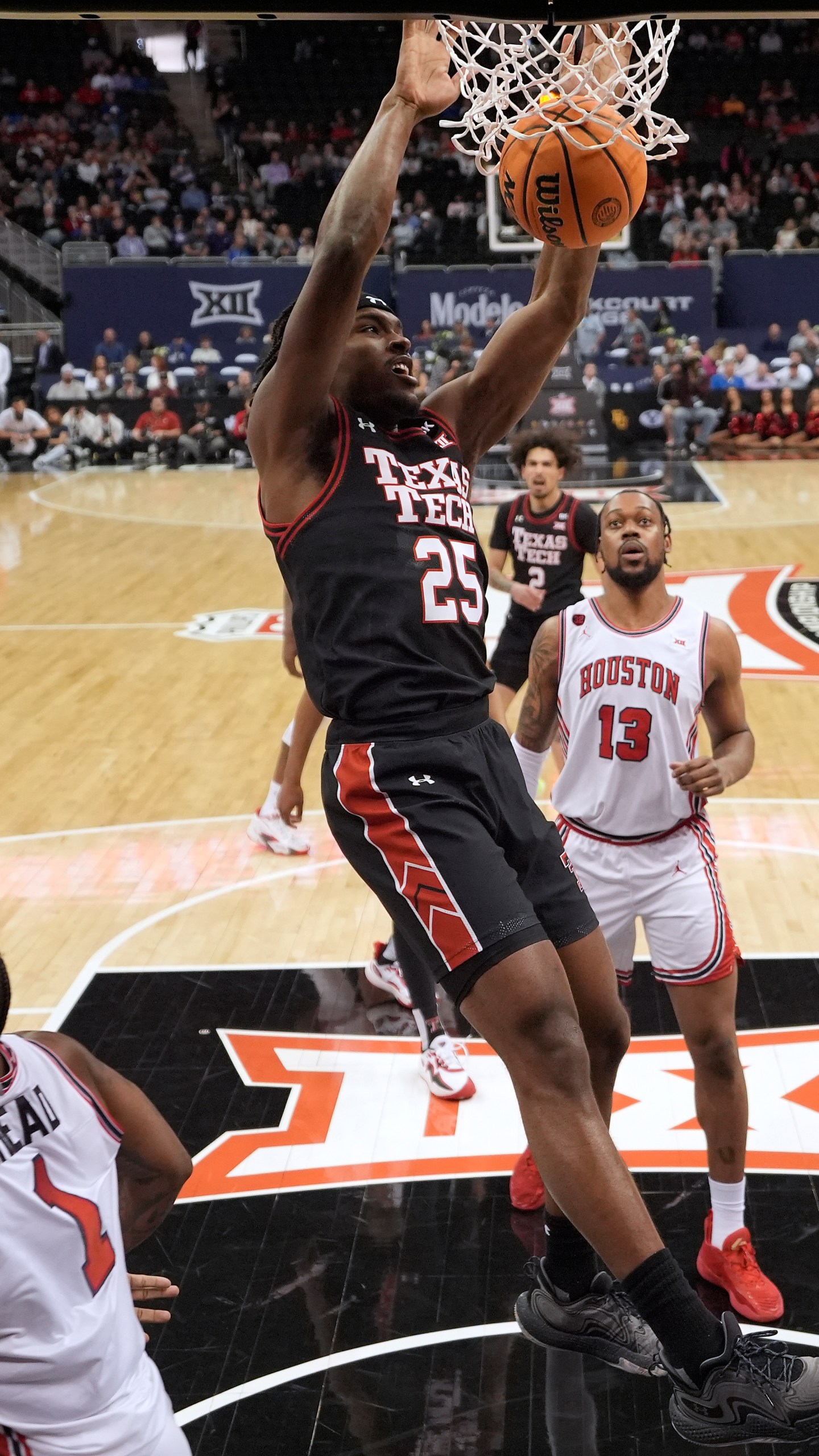Texas Tech forward Robert Jennings (25) dunks the ball during the first half of an NCAA college basketball game against Houston in the semifinal round of the Big 12 Conference tournament, Friday, March 15, 2024, in Kansas City, Mo. (AP Photo/Charlie Riedel)