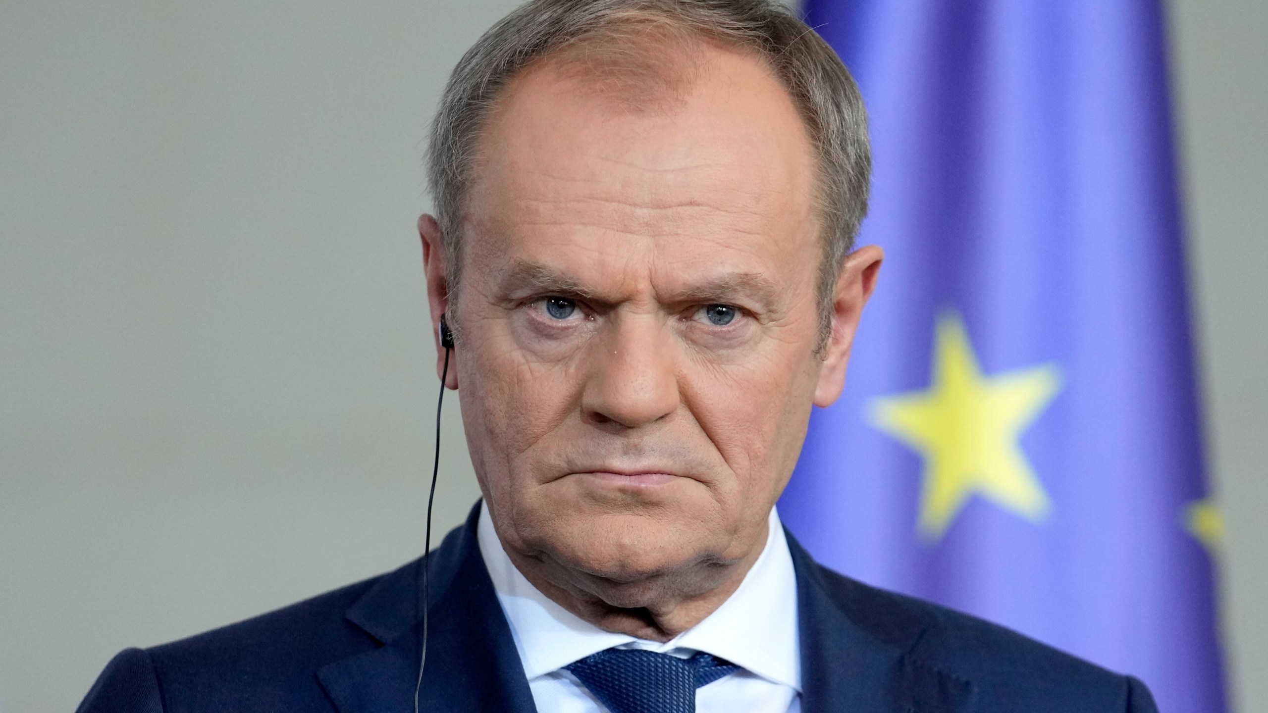 Poland's Prime Minister Donald Tusk listens to the media in Berlin, Germany, Friday, March 15, 2024. German Chancellor Olaf Scholz, France's President Emmanuel Macron and Poland's Prime Minister Donald Tusk meet in Berlin for the so-called Weimar Triangle talks. (AP Photo/Ebrahim Noroozi)