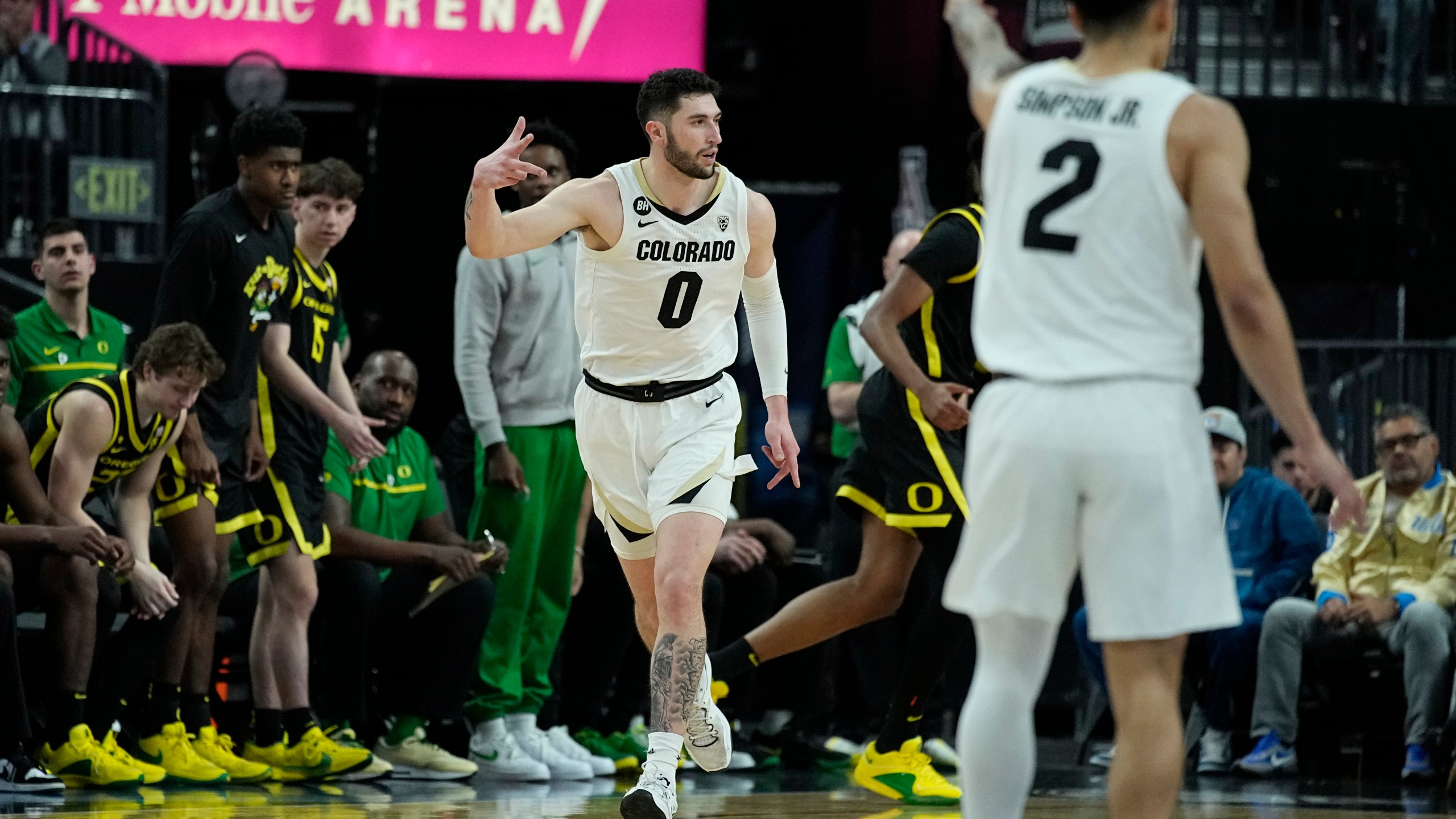 Colorado guard Luke O'Brien (0) celebrates after making a 3-point shot against Oregon) during the first half of an NCAA college basketball game in the championship of the Pac-12 tournament Saturday, March 16, 2024, in Las Vegas. (AP Photo/John Locher)