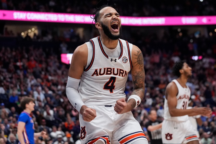 Auburn forward Johni Broome (4) reacts after a basket during the first half of an NCAA college basketball game against Florida in the fianls of the Southeastern Conference tournament Sunday, March 17, 2024, in Nashville, Tenn. (AP Photo/John Bazemore)