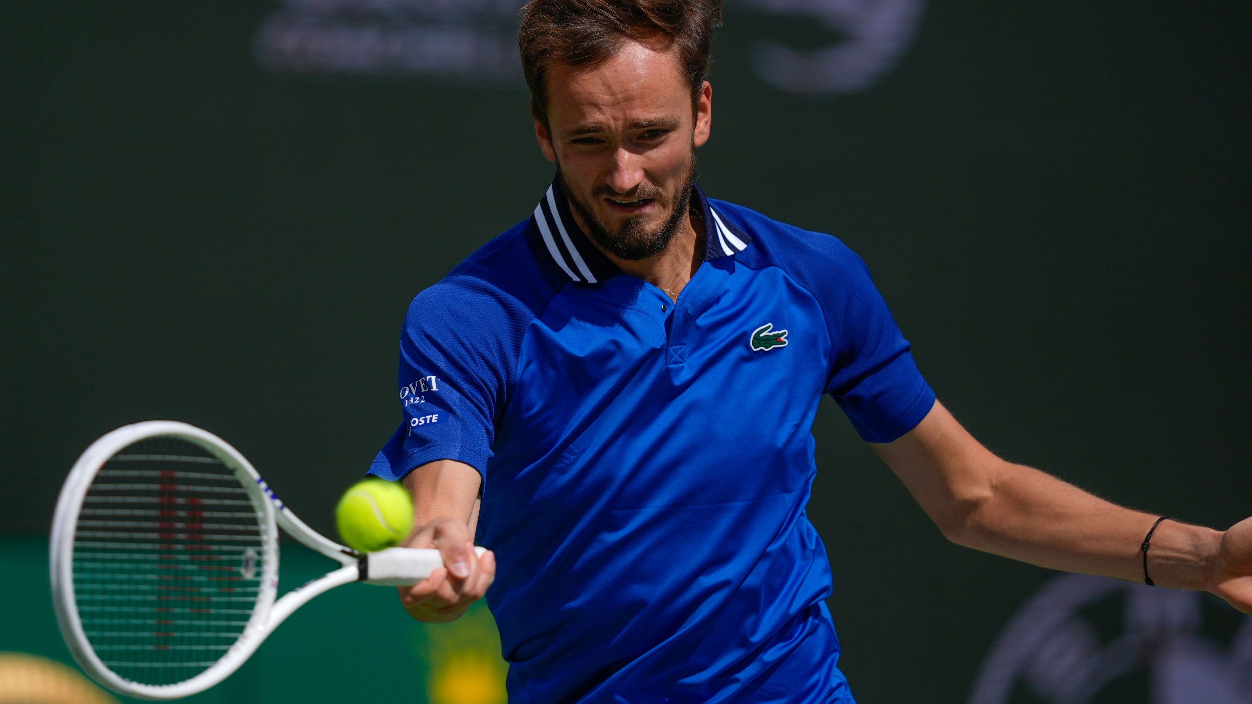 Daniil Medvedev, of Russia, returns to Carlos Alcaraz, of Spain, during the final match at the BNP Paribas Open tennis tournament, Sunday, March 17, 2024, in Indian Wells, Calif. (AP Photo/Ryan Sun)