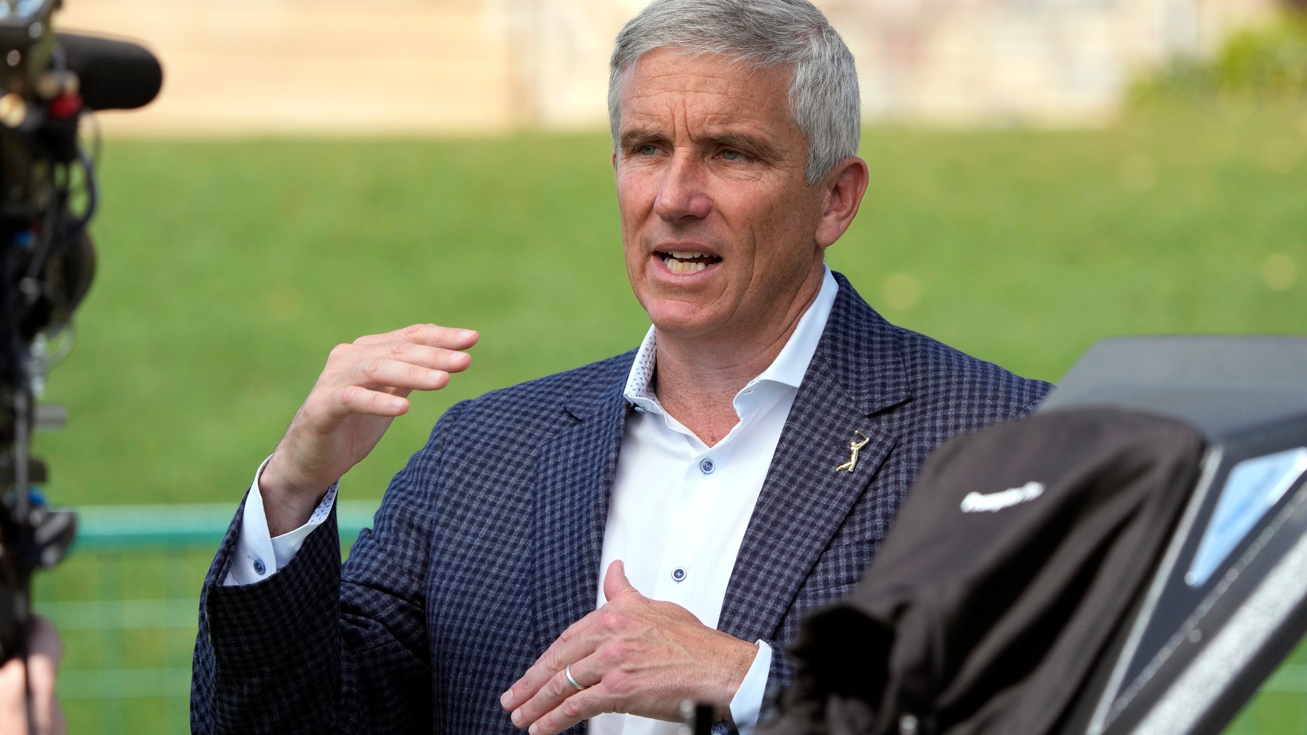 PGA Tour commissioner Jay Monahan gestures during an interview during the second round of The Players Championship golf tournament Friday, March 15, 2024, in Ponte Vedra Beach, Fla. (AP Photo/Lynne Sladky)