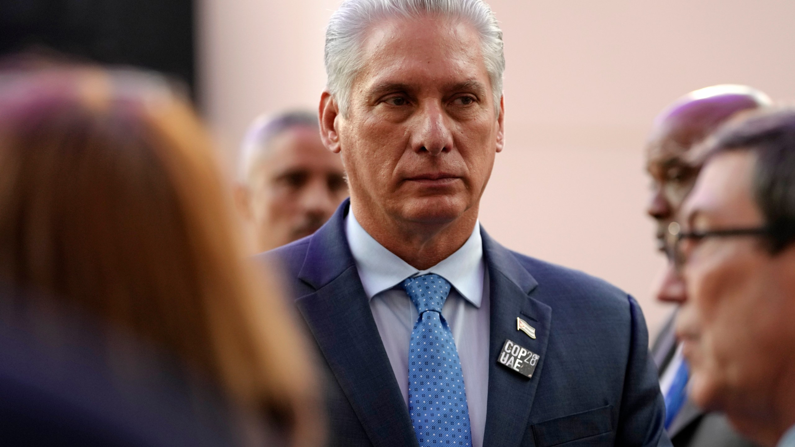 FILE - Cuba President Miguel Diaz-Canel walks through the COP28 U.N. Climate Summit, Saturday, Dec. 2, 2023, in Dubai, United Arab Emirates. Small groups of protesters took to the streets in the eastern city of Santiago on Sunday, March 18, 2024, decrying power outages lasting up to eight hours and food shortages across Cuba. President Miguel Díaz-Canel also referred to protests in a social media post, though he did not specify where they occurred.(AP Photo/Peter Dejong, File)