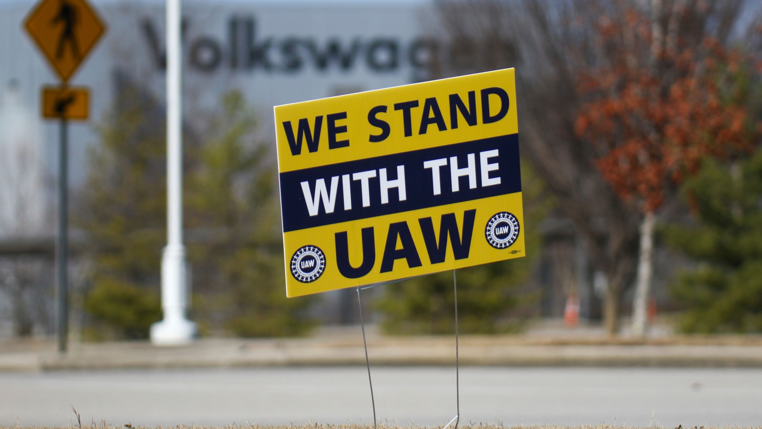 A "We stand with the UAW" sign is placed outside of the Volkswagen plant in Chattanooga, Tenn., on Dec. 18, 2023. Volkswagen’s factory in Chattanooga is likely to be the first test of the United Auto Workers’ effort to organize nonunion automobile plants across the nation. The union said workers at the factory filed paperwork Monday, March 18, 2024 with the National Labor Relations Board seeking a union representation election. (Olivia Ross/Chattanooga Times Free Press via AP, file)