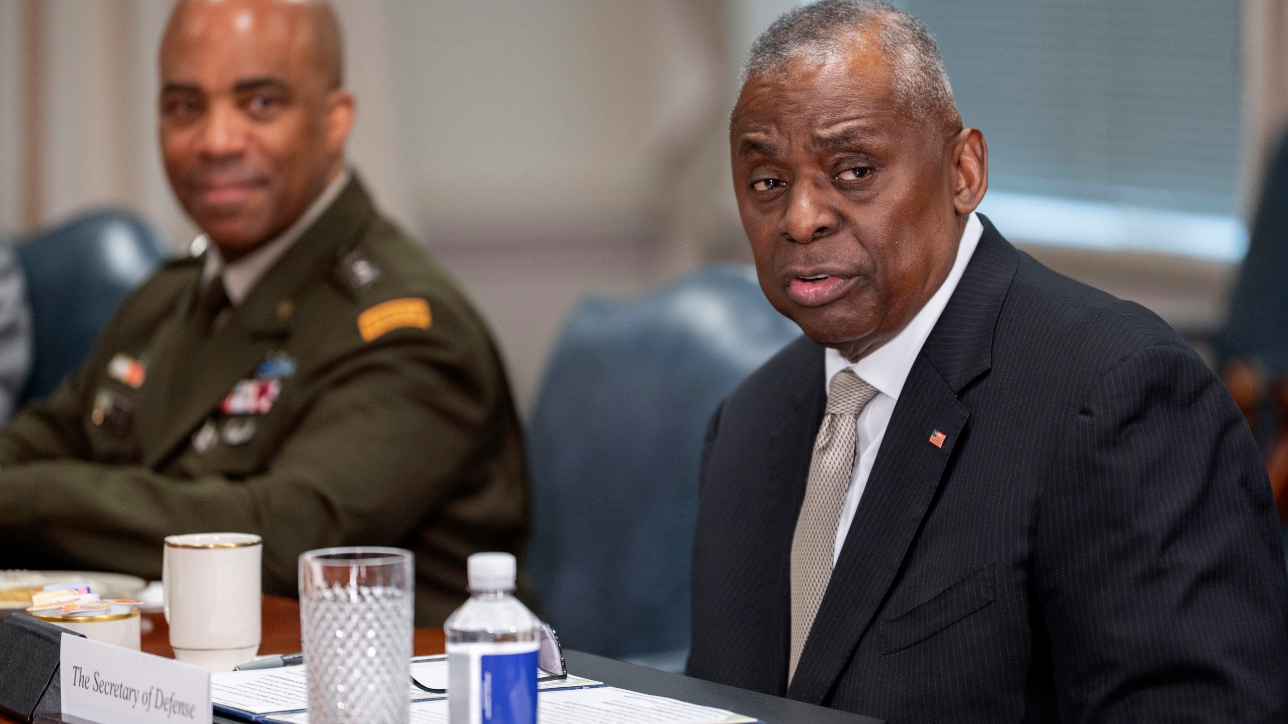 Secretary of Defense Lloyd Austin, right, speaks during a meeting with Latvian Defense Minister Andris Spruds, not pictured, at the Pentagon on Thursday, March 14, 2024, in Washington. (AP Photo/Kevin Wolf)