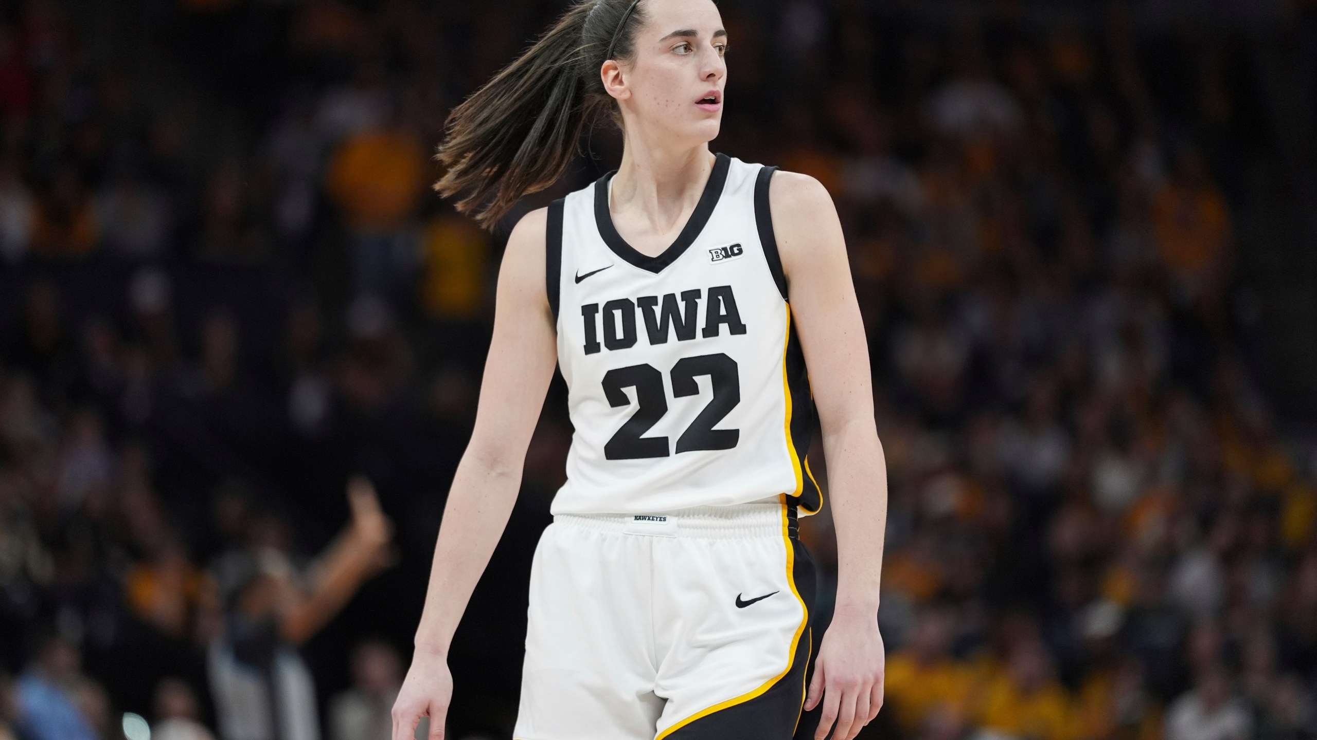 Iowa guard Caitlin Clark (22) stands on the court during the first half of an NCAA college basketball game against Nebraska in the final of the Big Ten women's tournament Sunday, March 10, 2024, in Minneapolis. (AP Photo/Abbie Parr)