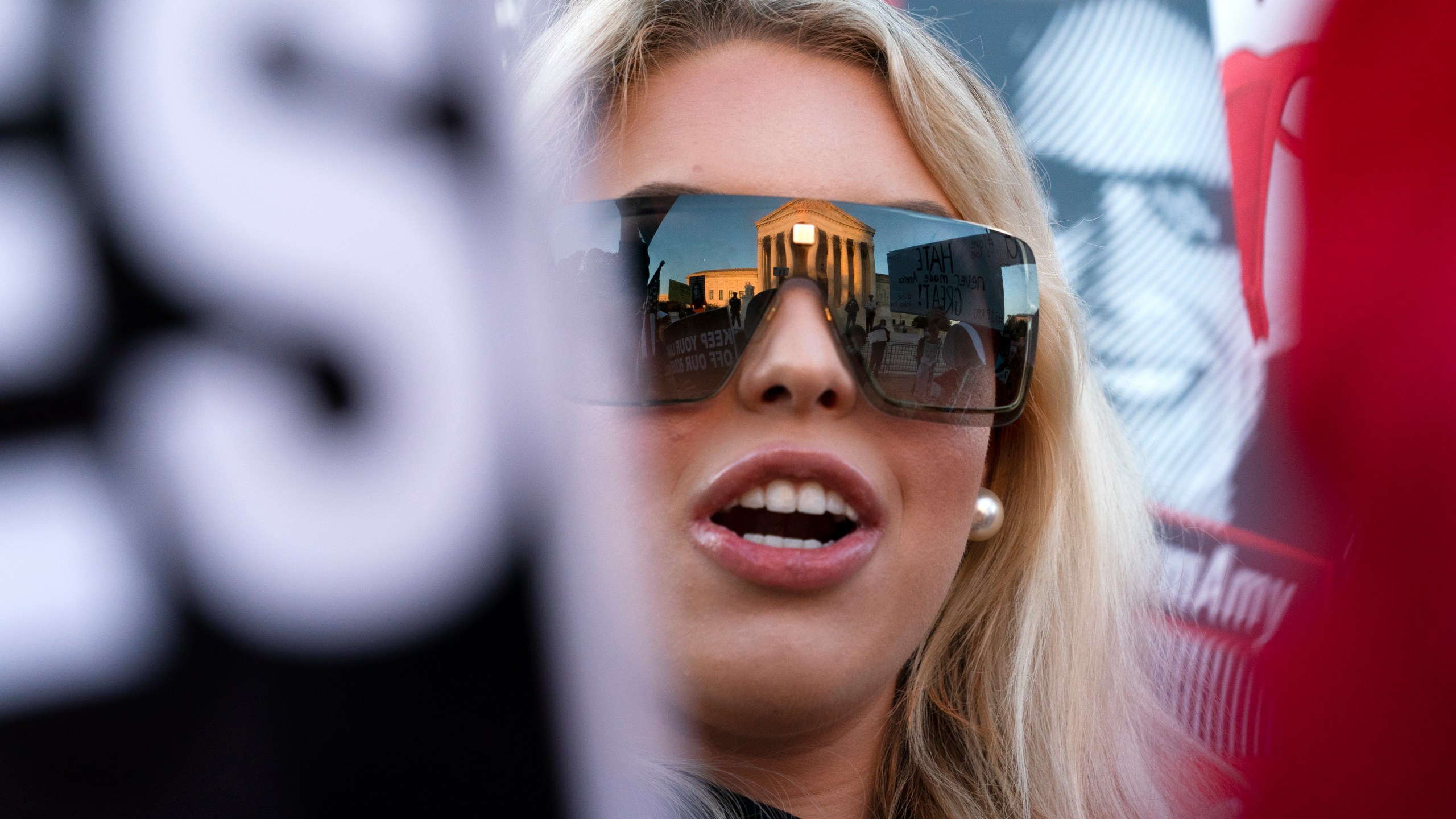 FILE - Isabella DeLuca, of Long Island, N.Y., appears outside the Supreme Court, Oct. 26, 2020, on Capitol Hill in Washington. DeLuca, a conservative social media influencer, has been charged with storming the U.S. Capitol. Court records unsealed Monday, March 18, 2024, show that DeLuca is charged with misdemeanors, including theft of government property, disorderly conduct and entering a restricted area. She was arrested last Friday in Irvine, Calif. (AP Photo/Jacquelyn Martin, File)