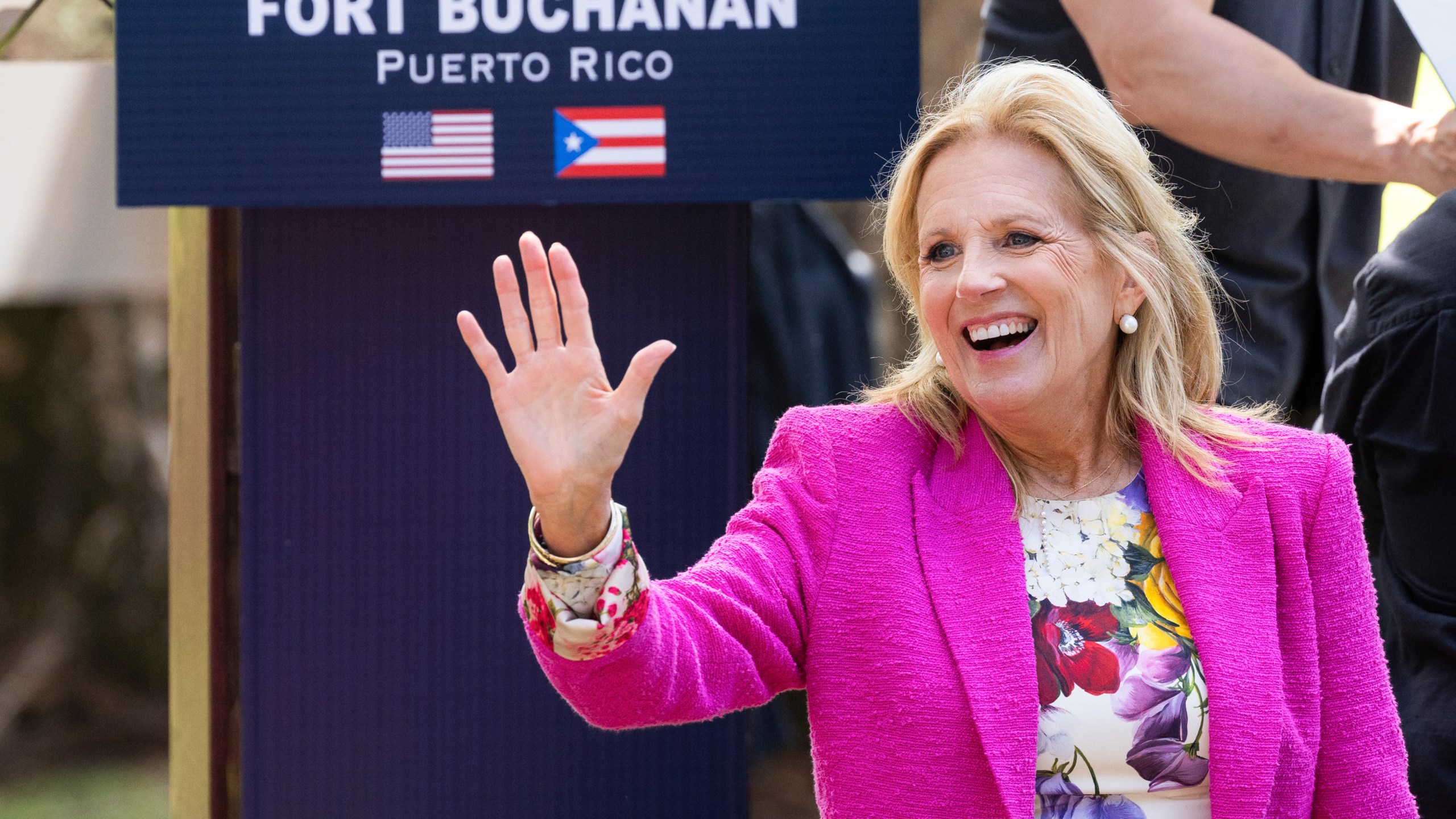 First Lady Jill Biden waves to attendees during an event with military families at Fort Buchanan in San Juan, Puerto Rico, Sunday, March. 17, 2024. (AP Photo/Alejandro Granadillo)